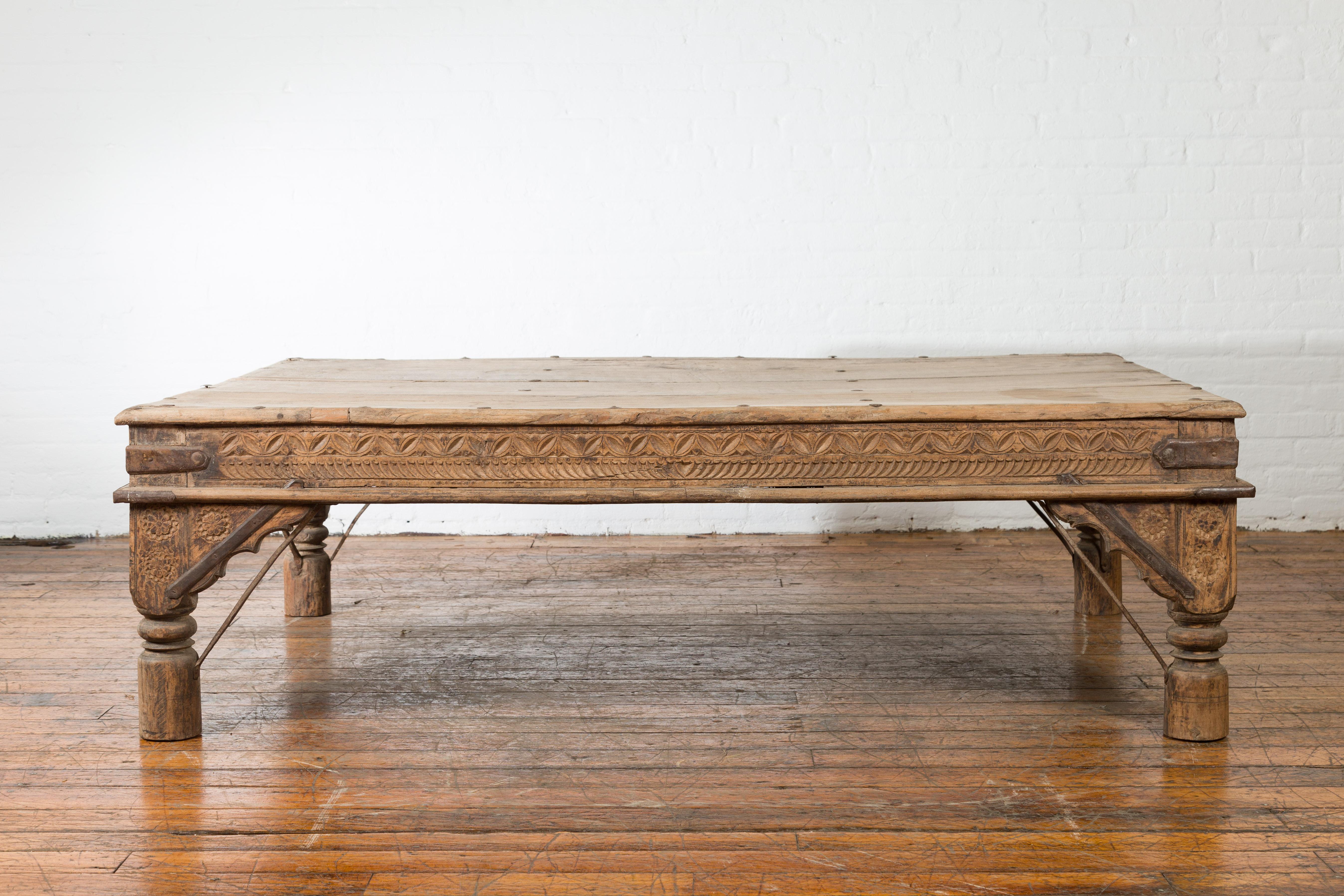 Oversized Antique Temple Door with Studs Made into a Carved Coffee Table 5
