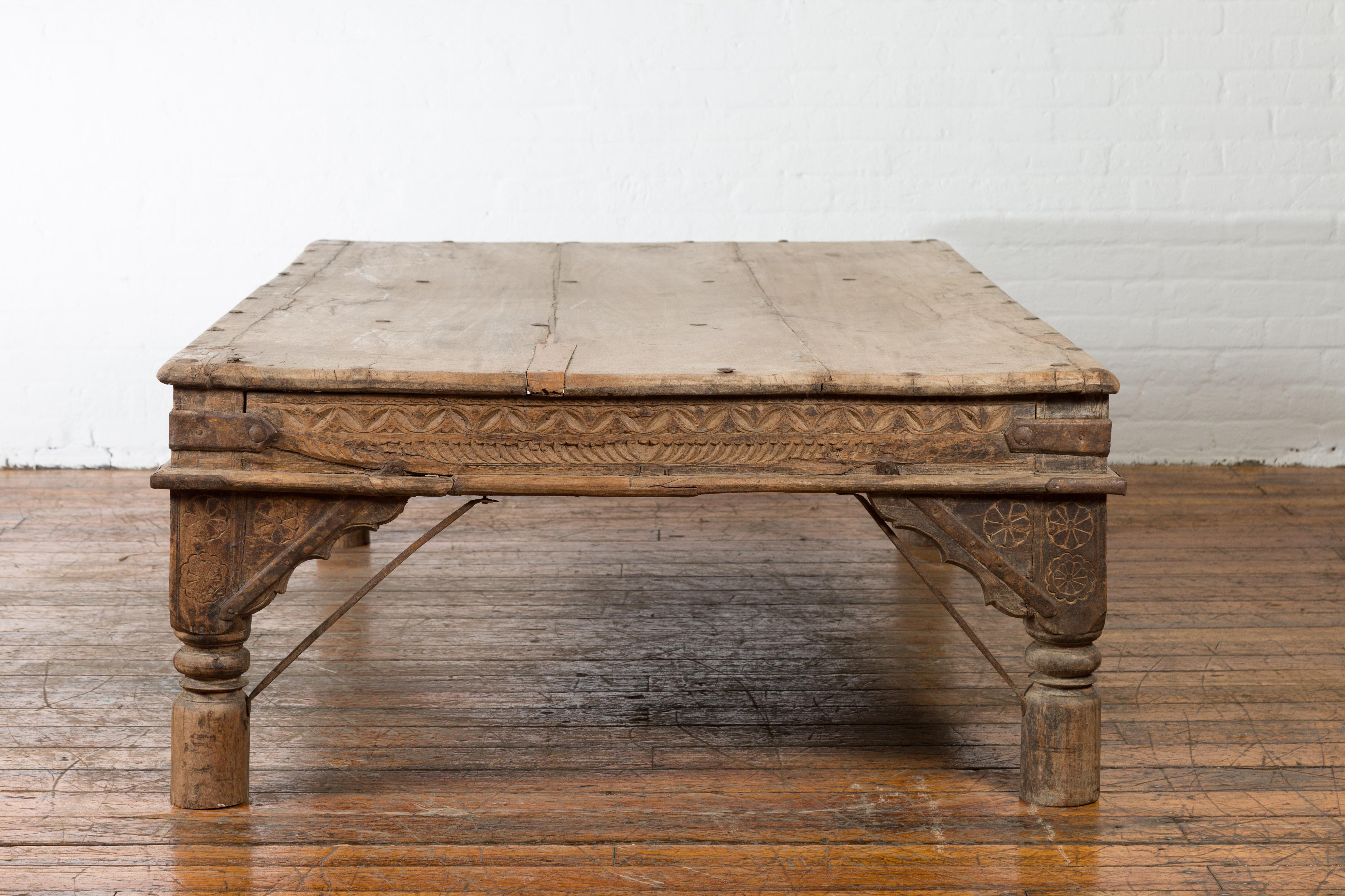 Oversized Antique Temple Door with Studs Made into a Carved Coffee Table 6