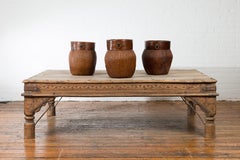 Oversized Antique Temple Door with Studs Made into a Carved Coffee Table