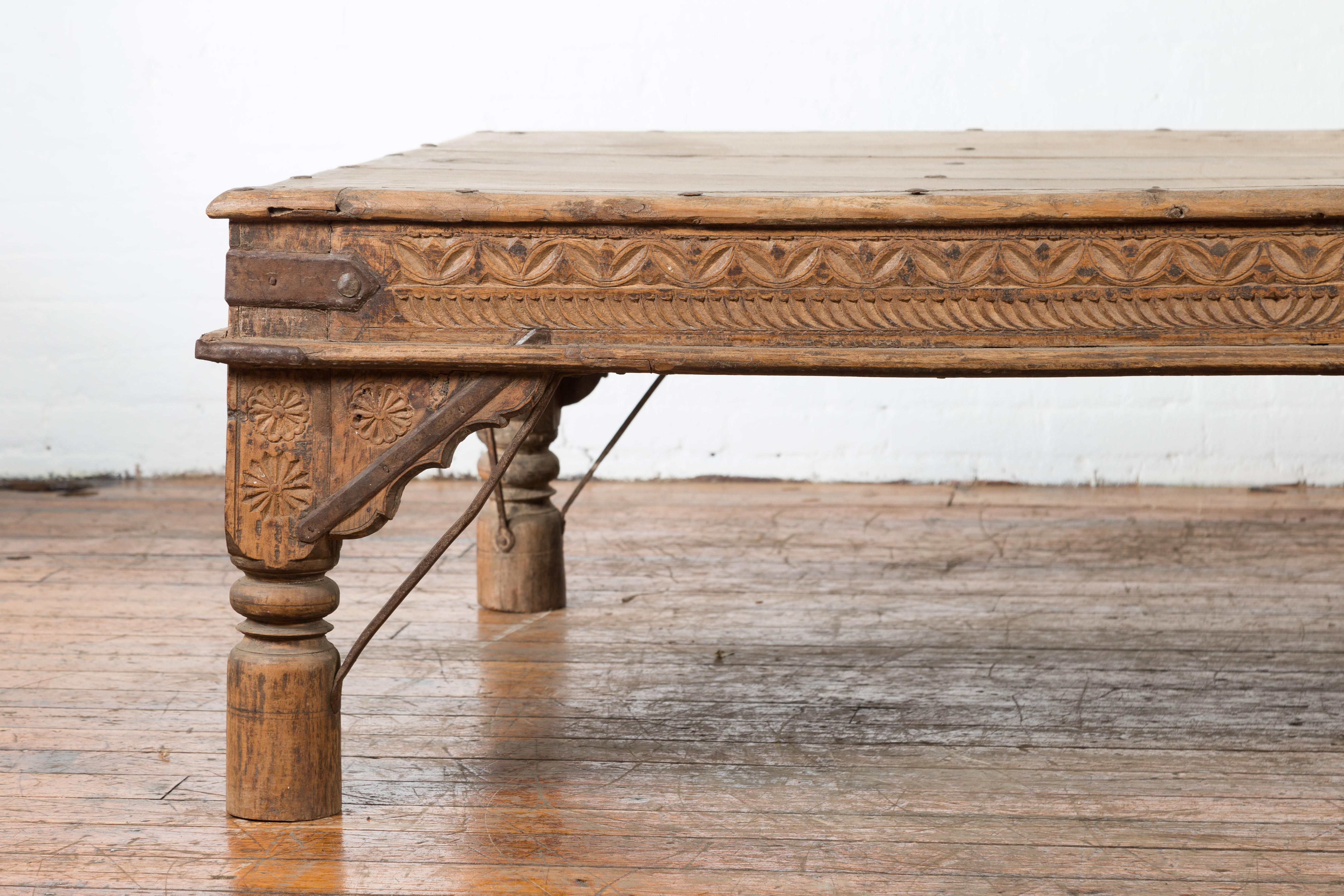 Iron Oversized Antique Temple Door with Studs Made into a Carved Coffee Table