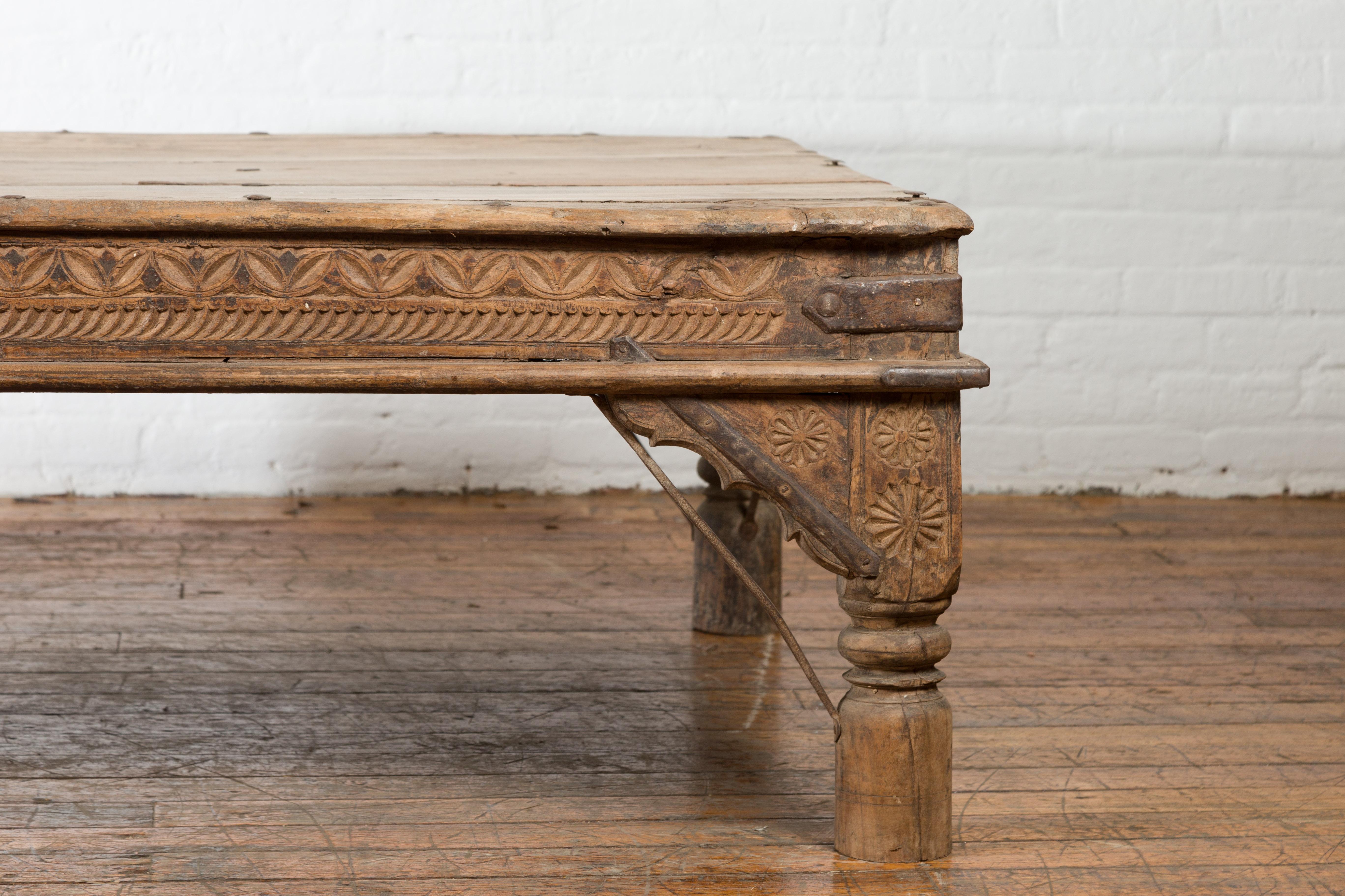 Oversized Antique Temple Door with Studs Made into a Carved Coffee Table 1