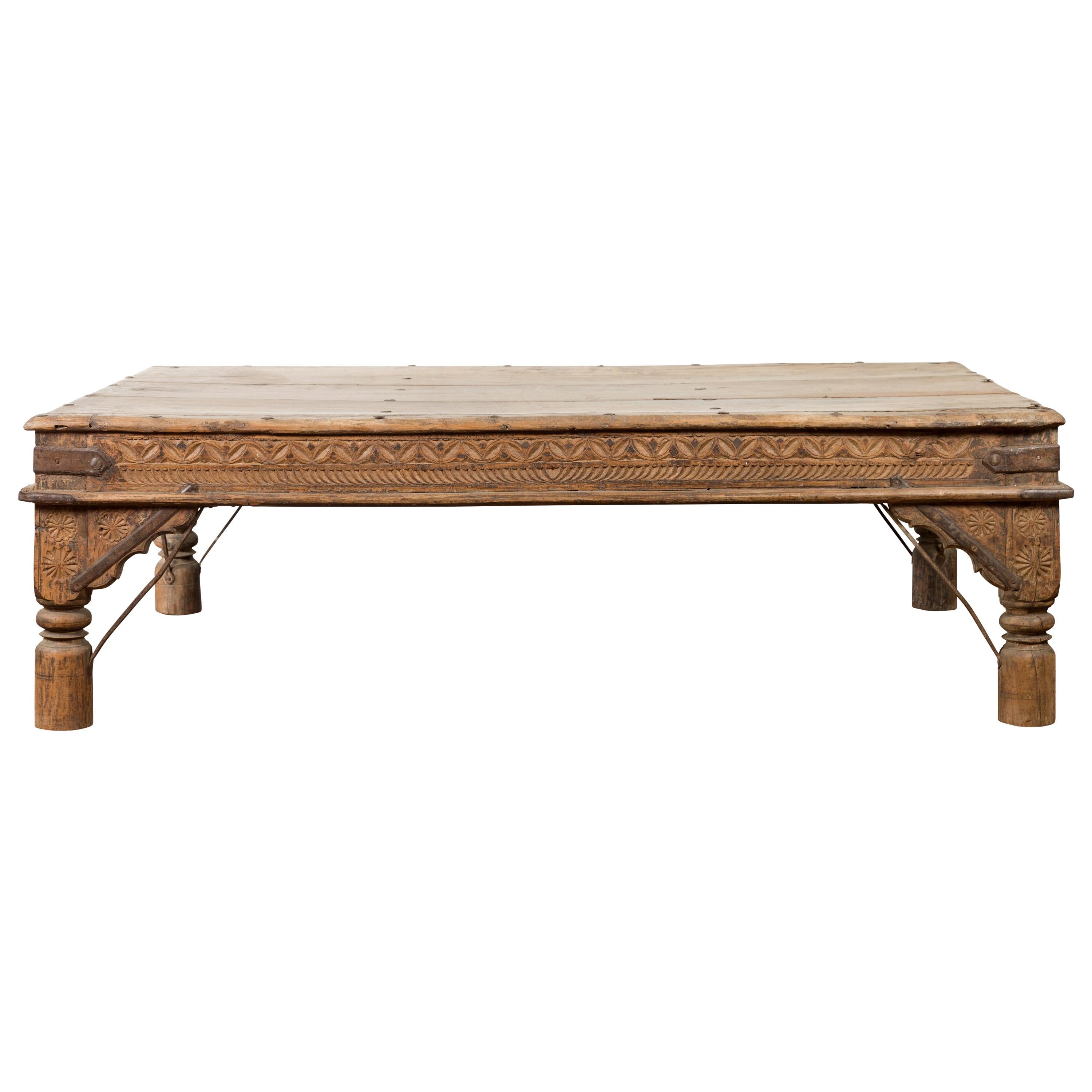 Oversized Antique Temple Door with Studs Made into a Carved Coffee Table