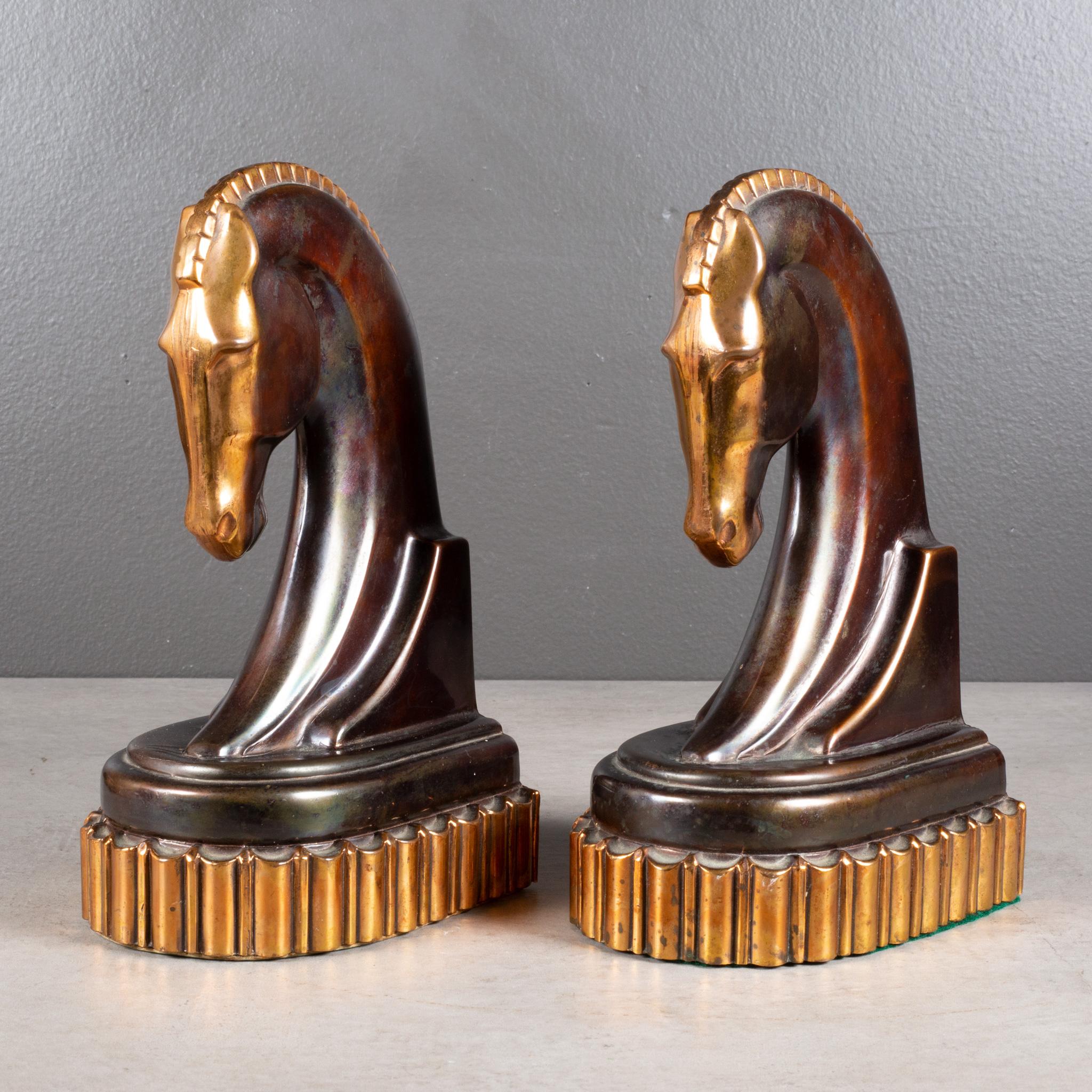 ABOUT

An oversize pair of Art Deco bronze and copper plated Trojan horse bookends on thick, copper plated plinth. Original bottom and label on one bookend.

Shown with life size hand model.

    CREATOR Metal Corp. Los Angeles.
    DATE OF