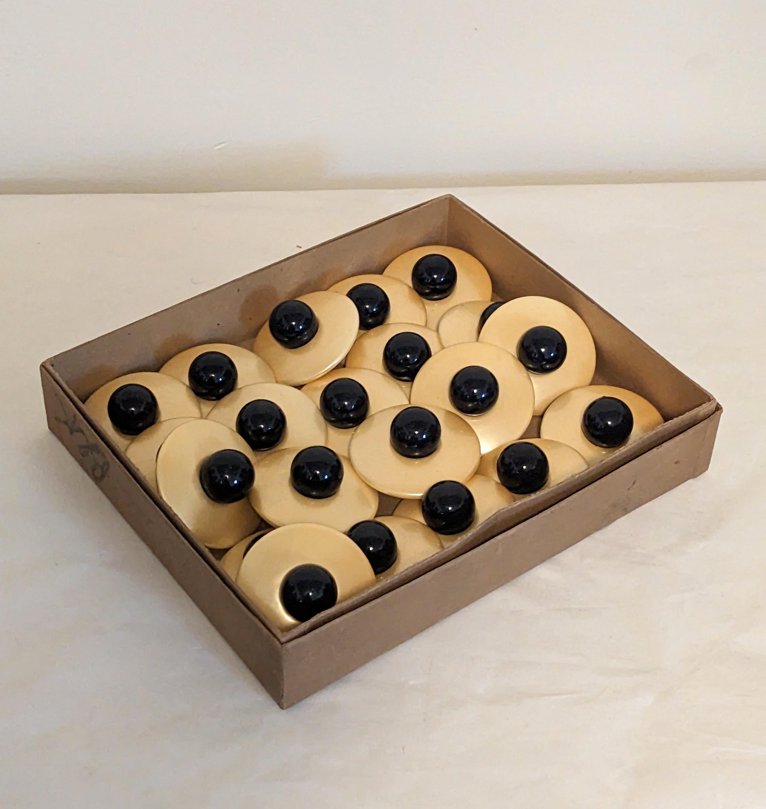 Oversized Art Deco Lacquered Buttons with mother of pearl and black lacquer. Made of wood with laquered finishes great for costuming. Donut shape base with large ball center. Each measures 2.25