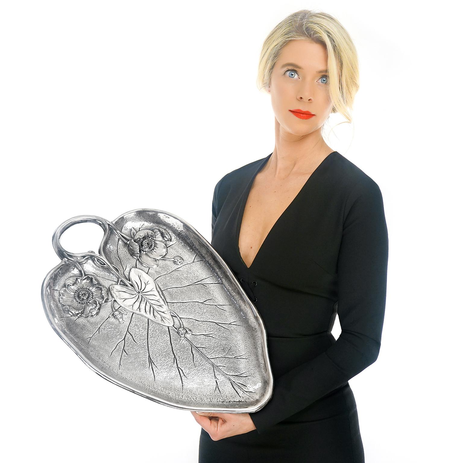 Circa 1937, Silverplate, by Reed & Barton, American. This brilliant silver Art Deco fantasy of a lily pad, leaf, and flowers is perfect as the focal point of any room, coffee table, or cabinet. Superbly made in silverplate by the renowned Boston