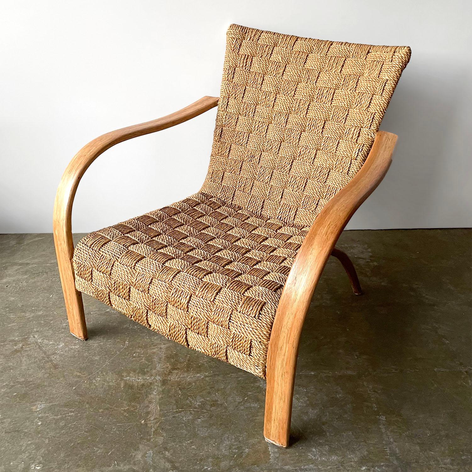 Oversized bentwood braided rope arm chair
Mid century sculptural gem
Braided cross stitched rope chair
Sculptural bentwood arms and legs
Natural color variations throughout
Patina from age and use
Newly reconditioned

This is the perfect chair for