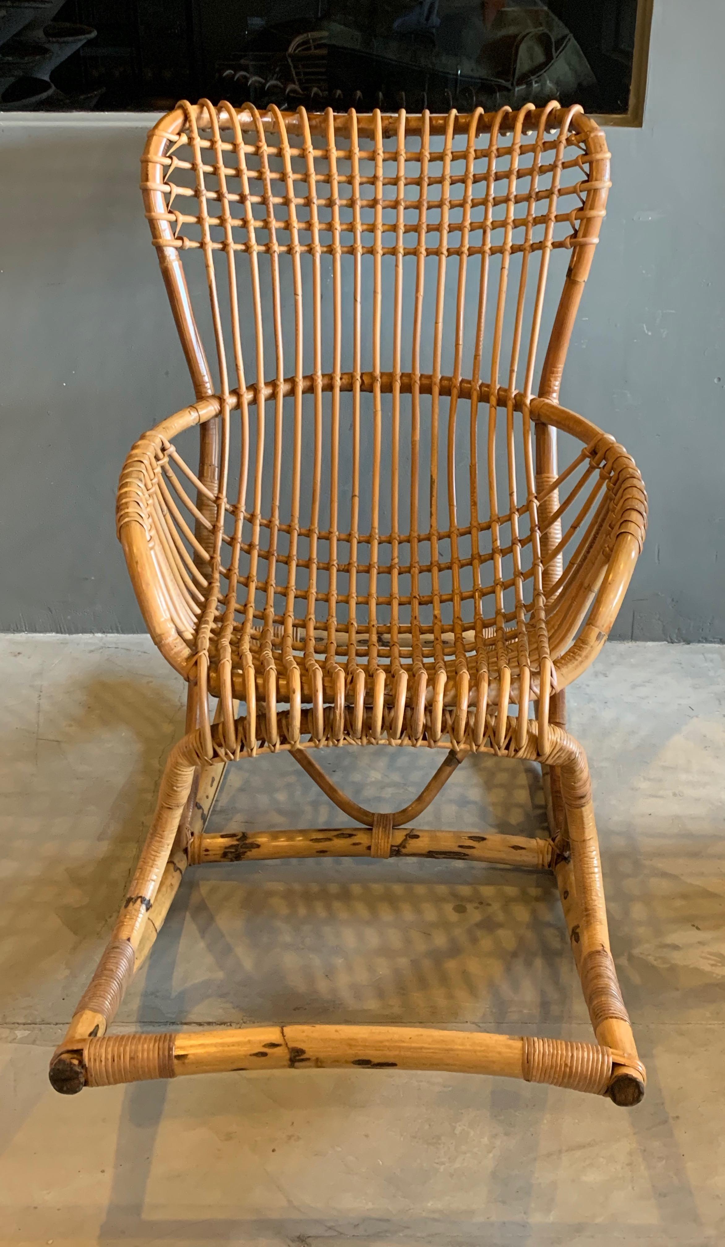Gorgeous rattan and bamboo rocking chair by Bonacina. Made in Italy. Very good vintage condition. Great sculptural chair. Large chair with a ton of presence.