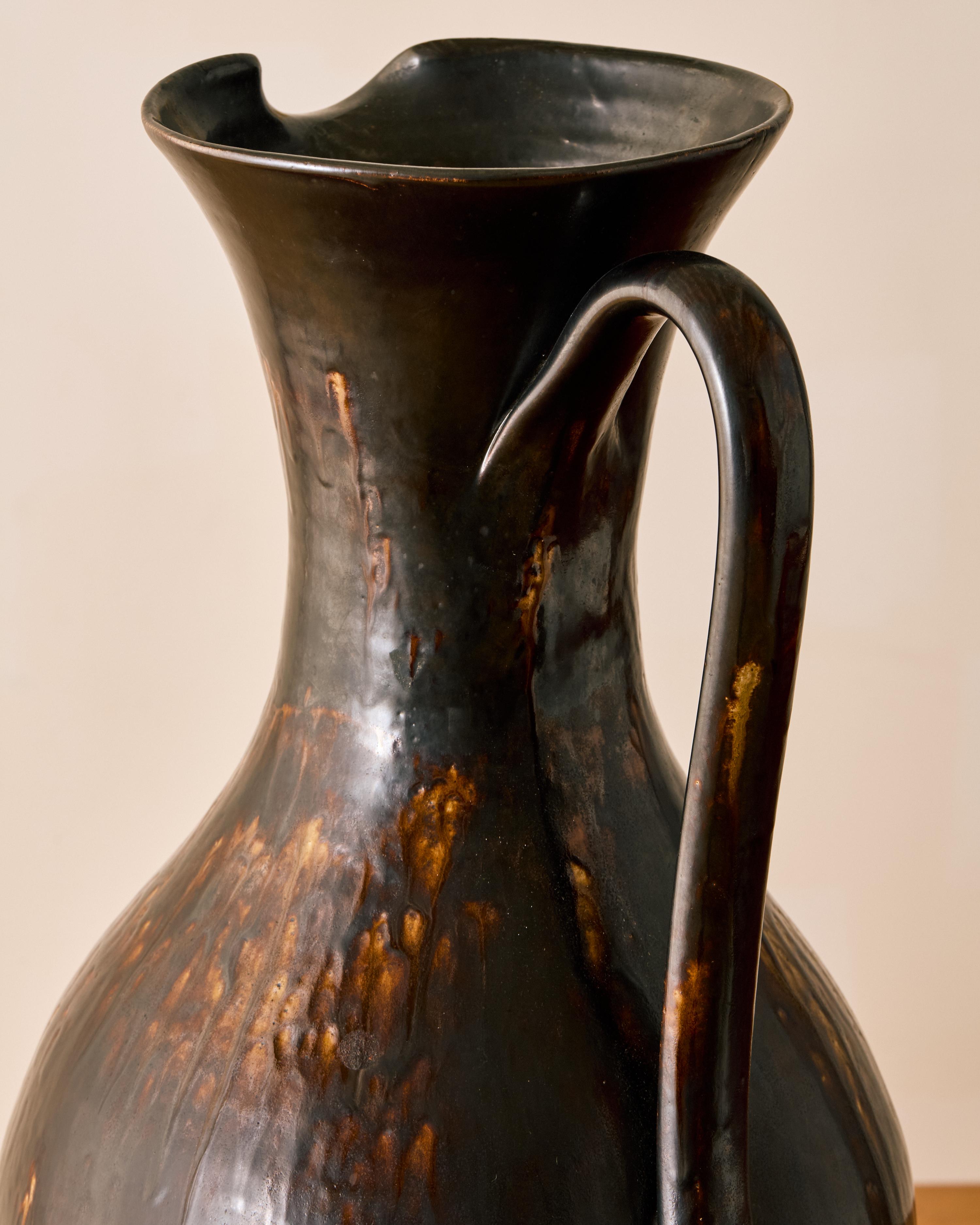 Oversized artisan made ceramic pitcher c. 1960. Stamped on bottom.