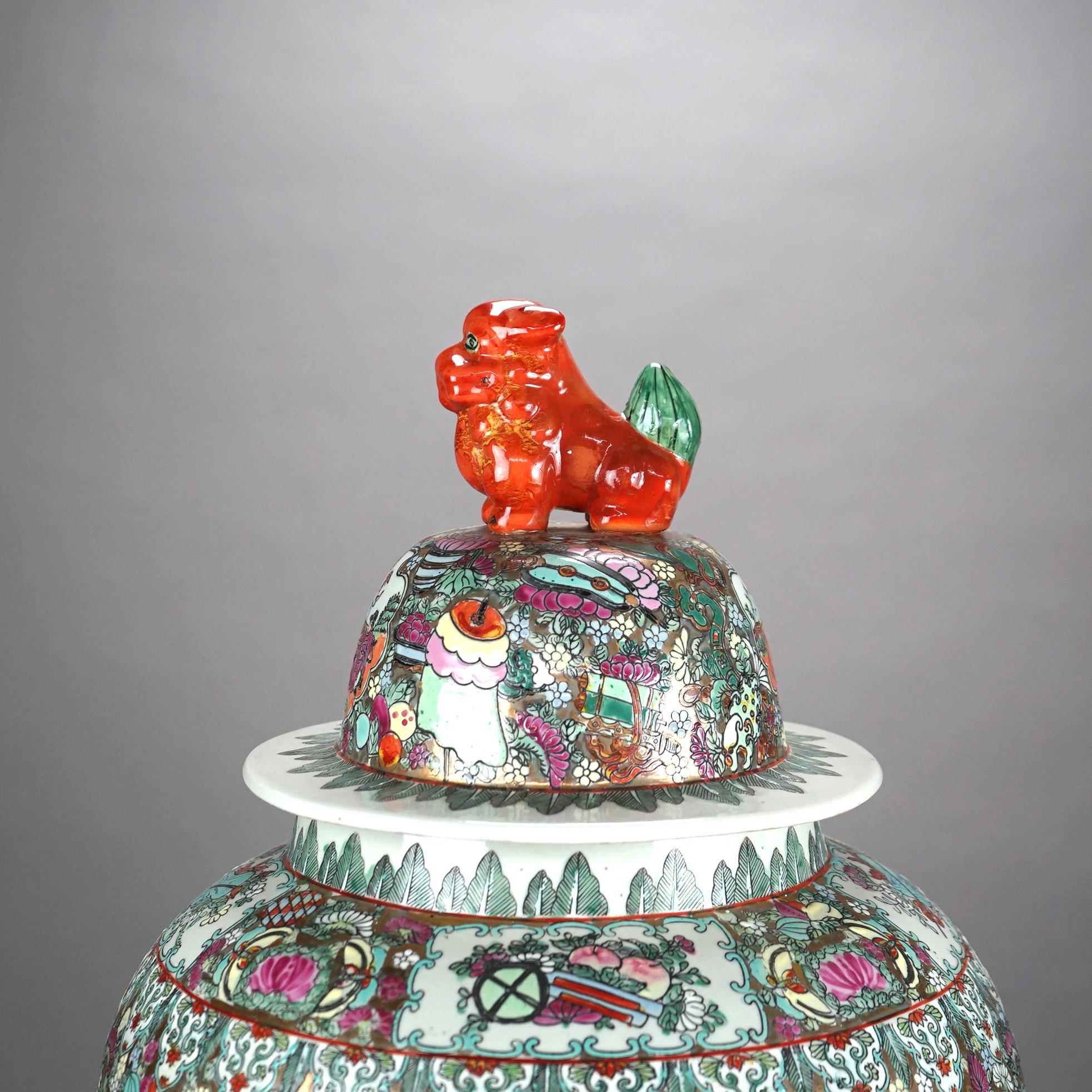 Oversized Chinese Rose Medallion Enameled Porcelain Figural Covered Urn with Foo Dog Finial & Genre Scenes 20thC

Measures - -25