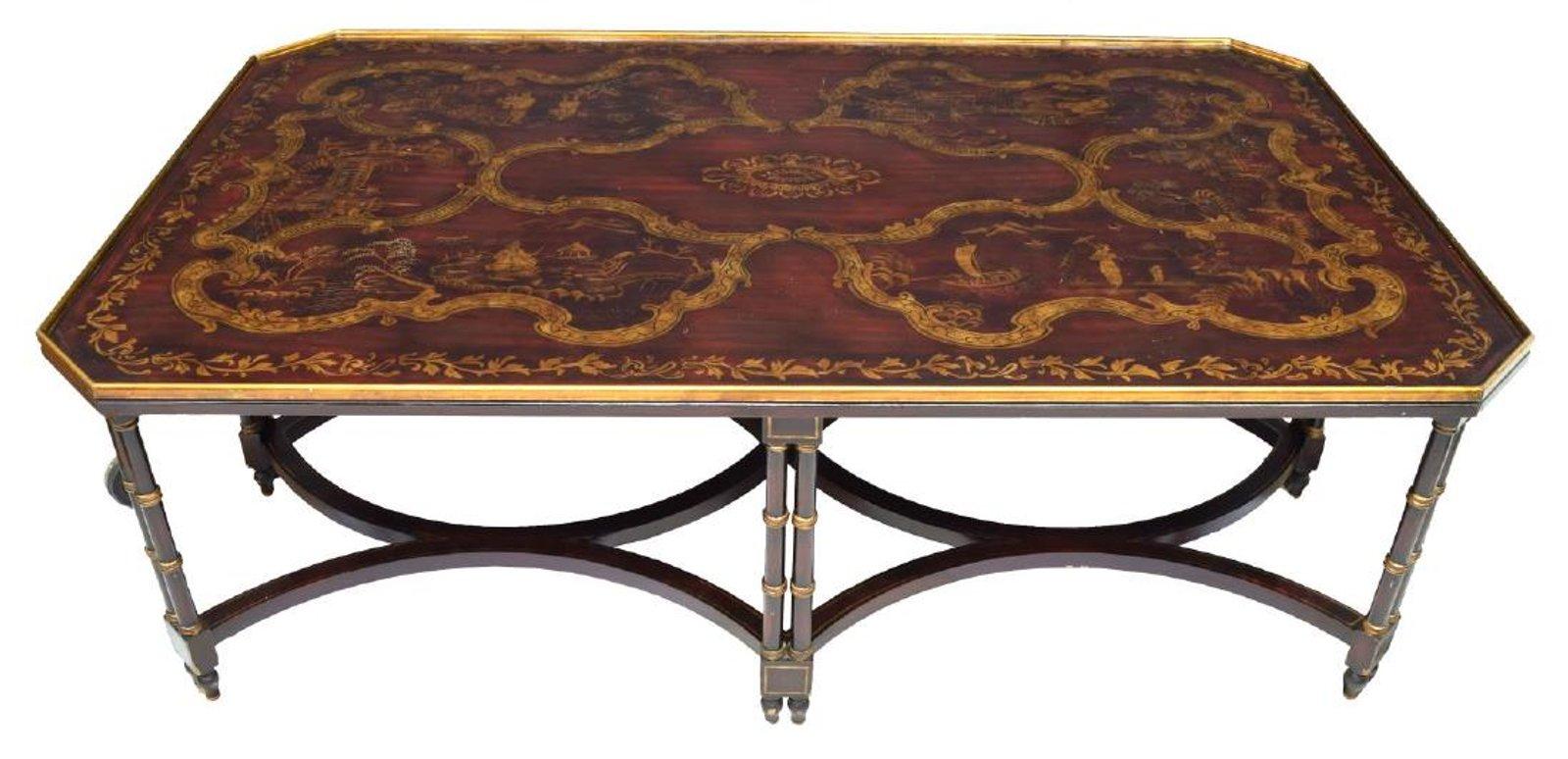 An oversized chinoiserie paint decorated coffee or cocktail table with faux bamboo legs and canted corners.