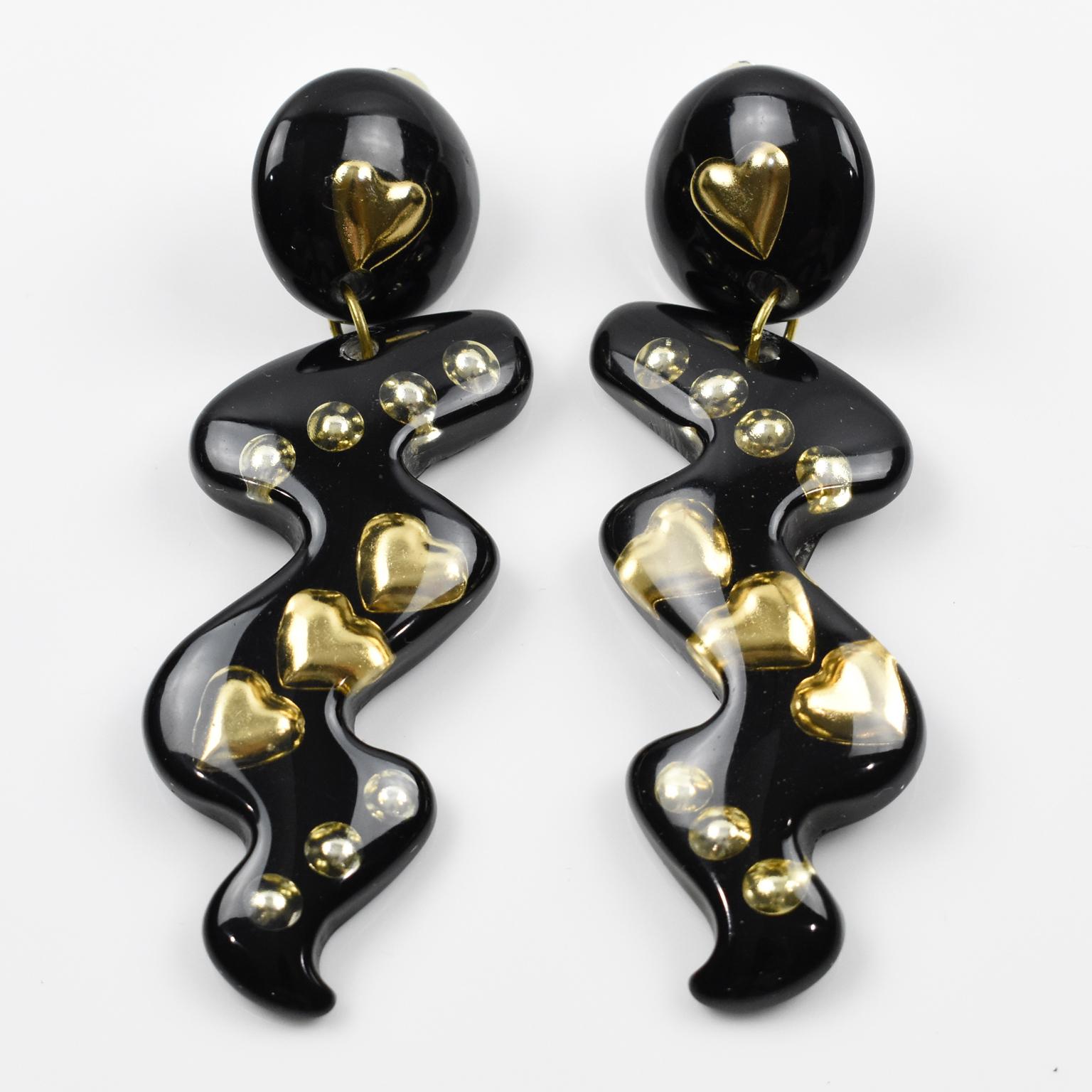 Modernist Oversized Dangle Black Lucite Clip Earrings with Gilded Heart Inclusions For Sale