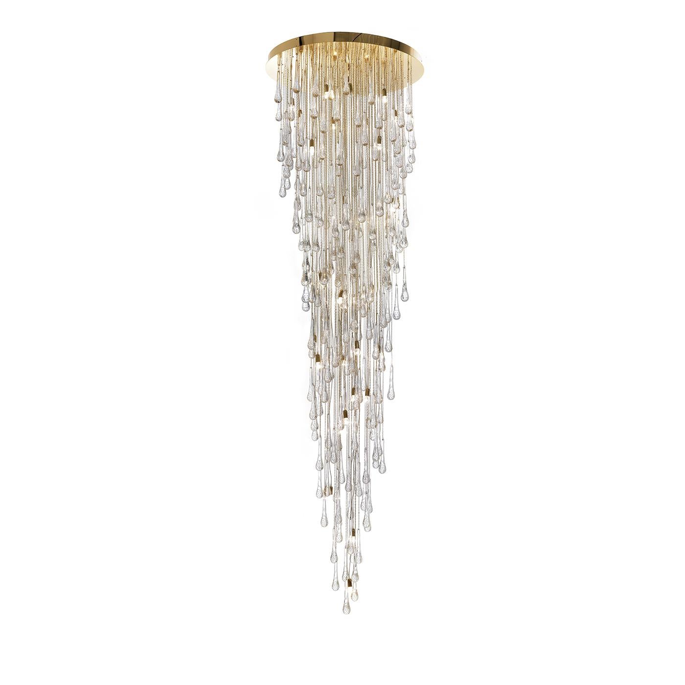 This magnificent chandelier will create a dramatic effect when placed either at the entrance of a house or in any room with a high ceiling. The imposing size of this piece is complemented by an ethereal aesthetic, an effect produced by hundreds of