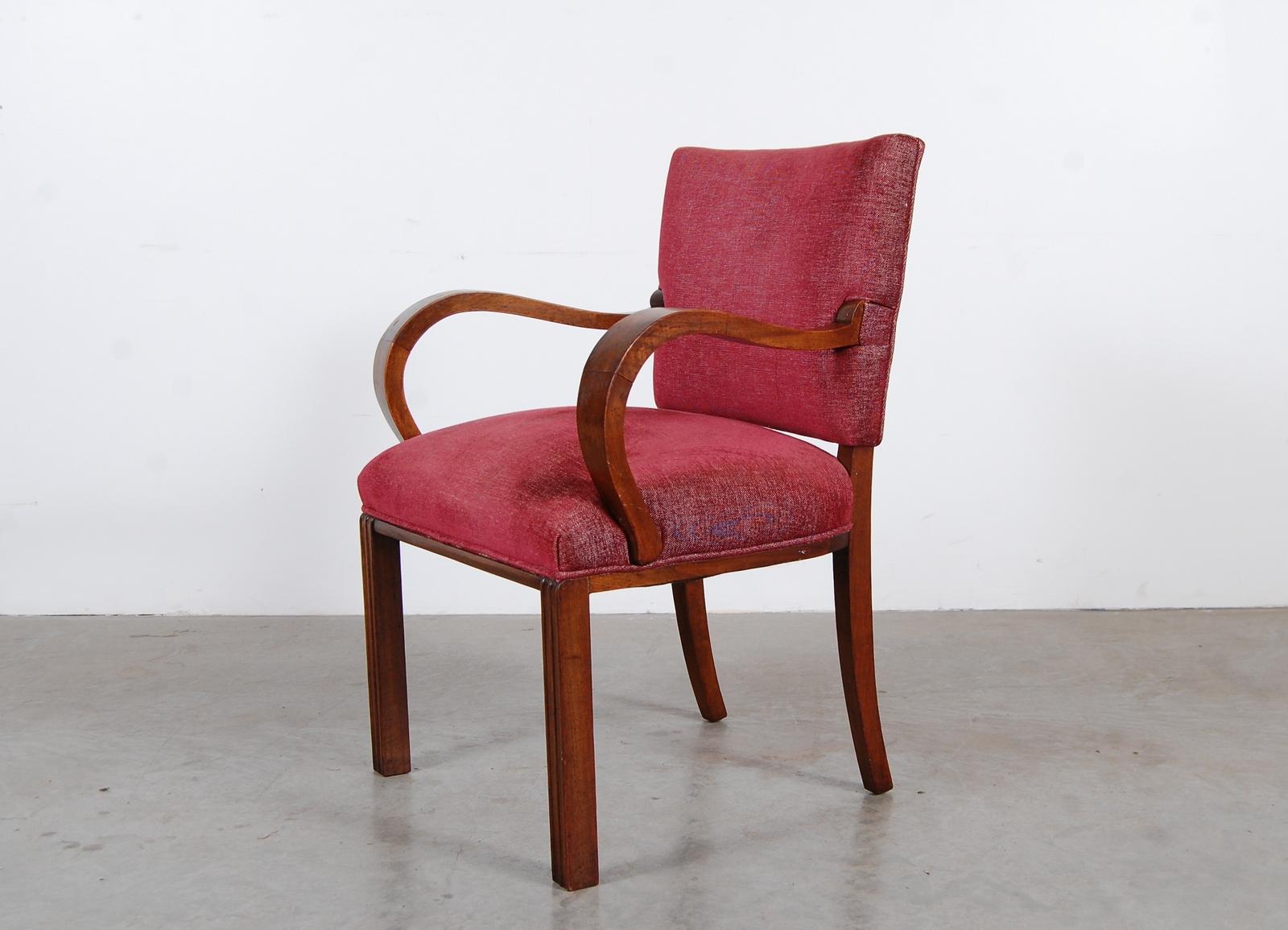 Oversized armchair in walnut, circa 1935. We are unsure of the exact origin of this chair, but feel very strongly that it's European. Possibly Hungarian, German, or Czech. Very well designed and constructed. The front of the legs are fluted, and