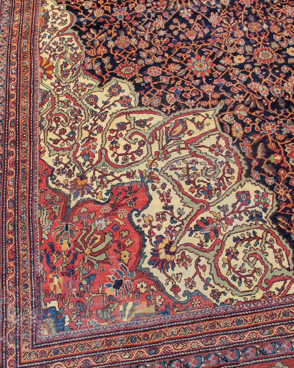 Antique Oversized Persian Fereghan Sarouk Carpet, Late 19th Century

Woven in central Persia, this elegant oversized Fereghan Sarouk draws a starburst medallion with an ivory center floating against a deep indigo ground. Layered networks of