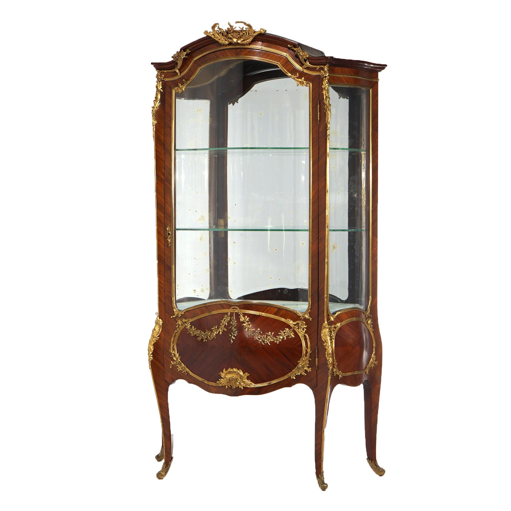 ***Ask About Reduced In-House Delivery Rates - Reliable Professional Service & Fully Insured***
Oversized Francois Linke (1855-1946) Signed Parisian Louis XIV vitrine offers kingwood and mahogany construction with cast foliate ormolu throughout,