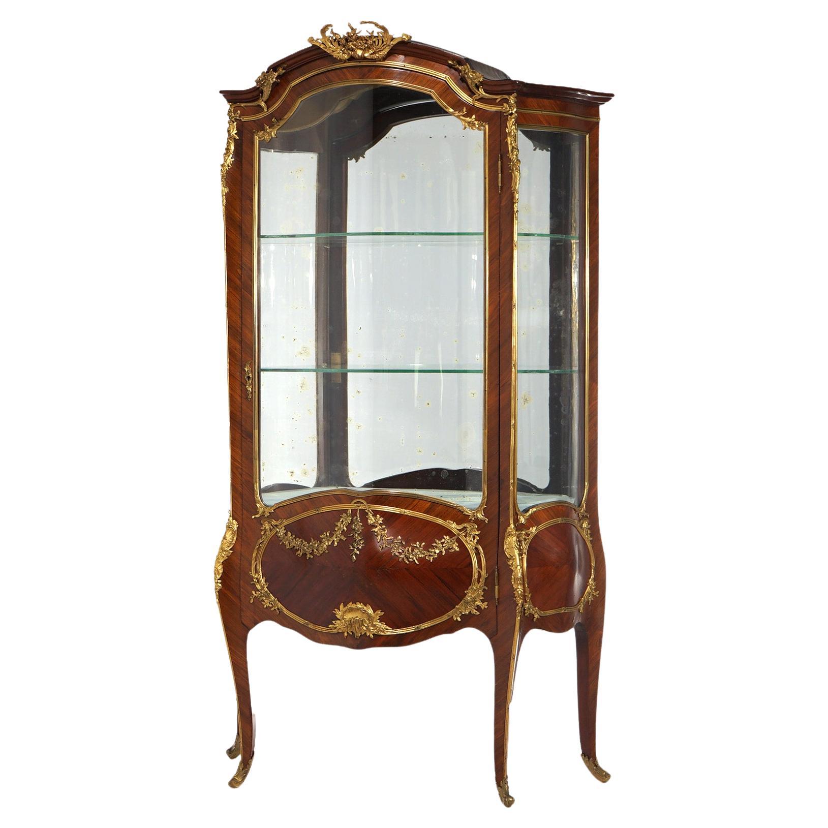 ***Ask About Reduced In-House Delivery Rates - Reliable Professional Service & Fully Insured***
Oversized Francois Linke (1855-1946) Signed Parisian Louis XIV vitrine offers kingwood and mahogany construction with cast foliate ormolu throughout,
