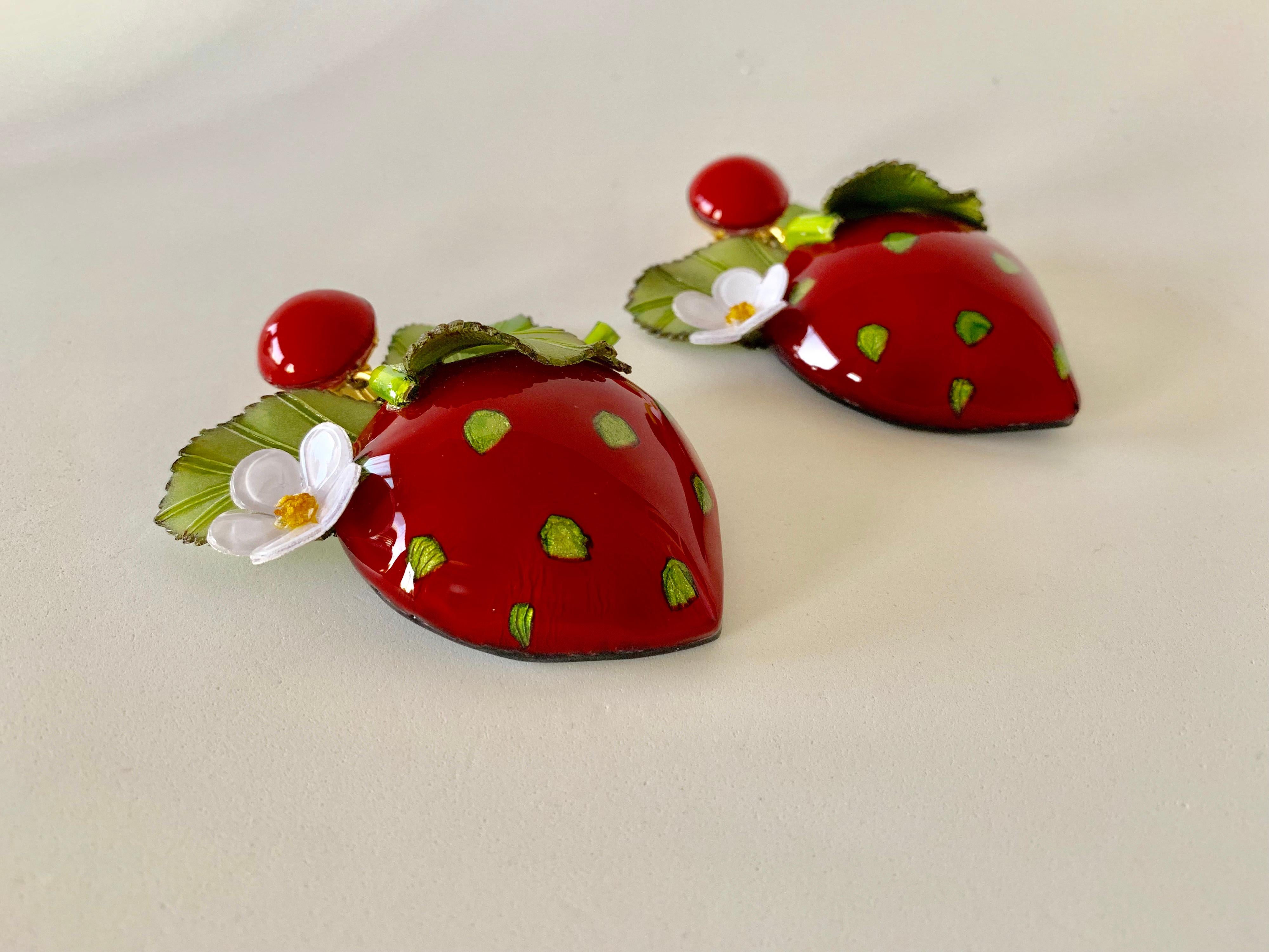 Light and easy to wear, these contemporary handmade artisanal contemporary clip-on earrings were made in Paris by Cilea. The lightweight statement earrings feature large detailed enameline (enamel and resin composite) strawberries. 

Each piece of