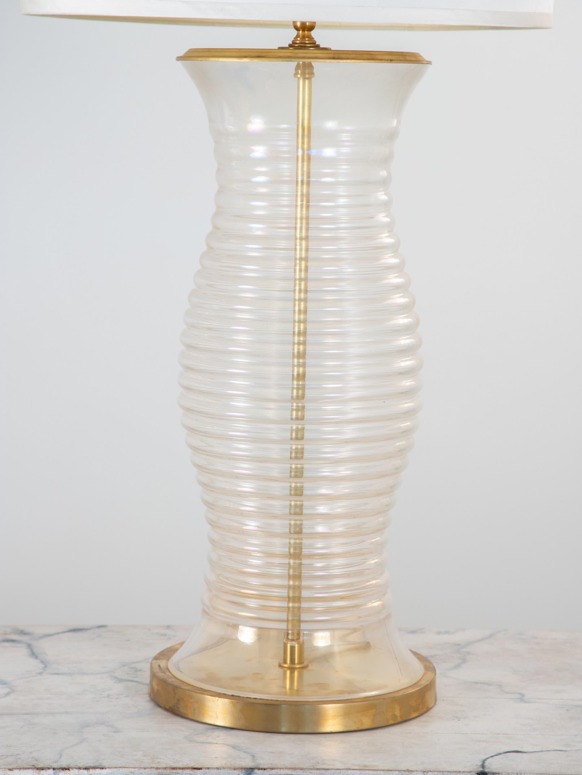 An oversized Murano opalescent glass lamp. A brass base and rod complement the golden opalescent finish. Found in Murano, this piece has been rewired for American outlets. Shade and harp are not included.