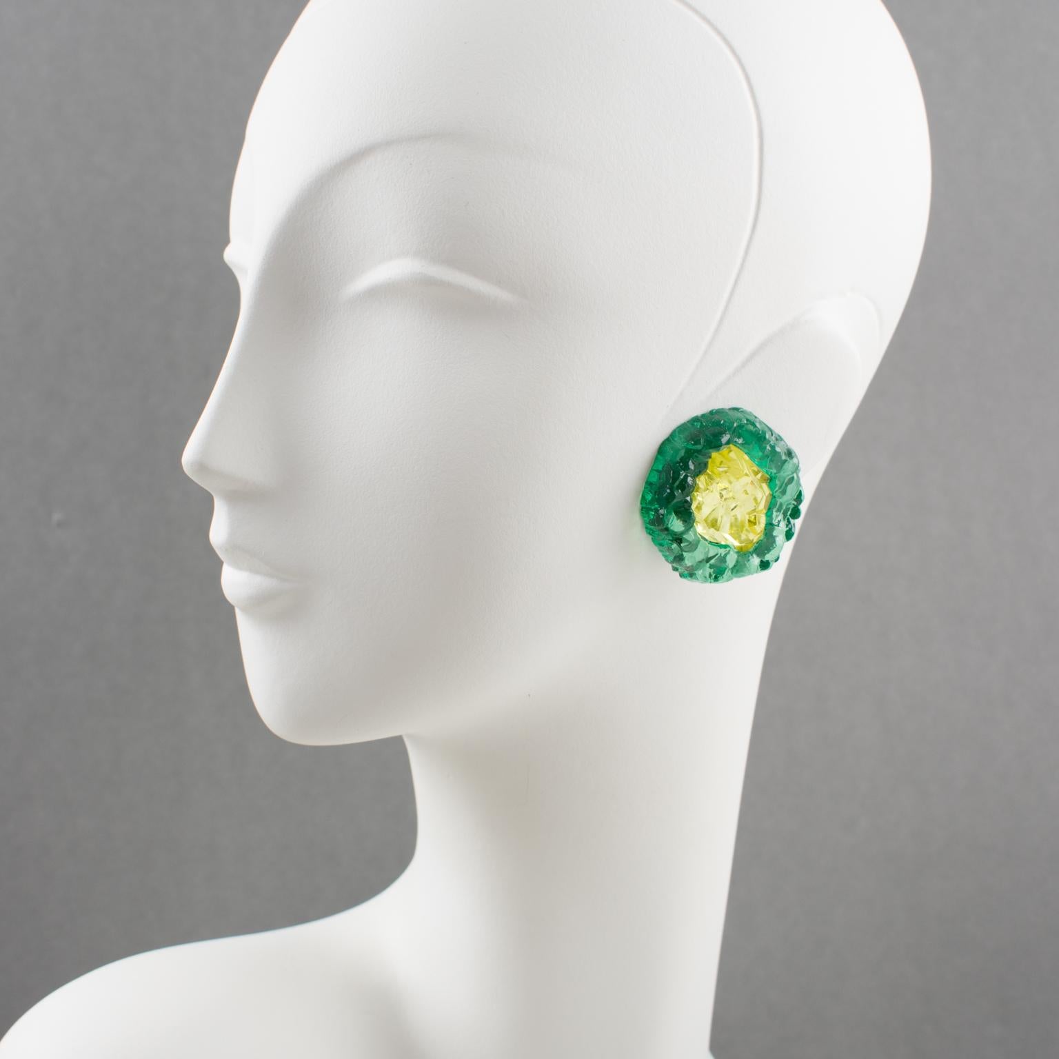 Impressive oversized carved Lucite clip-on earrings from Italian designer studio. Dimensional rounded shape with rock carving in luminous transparent viridian green and lemon yellow colors. Very unusual shape. No visible maker's mark.
Measurements: