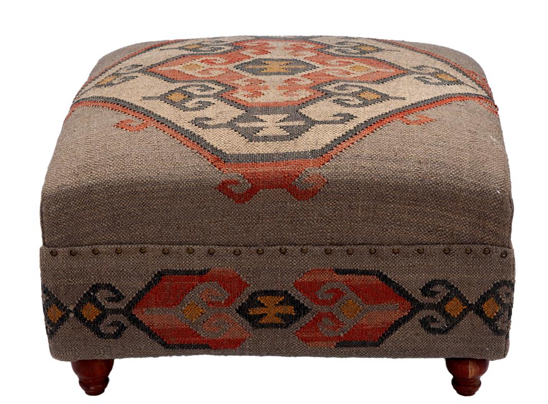 Oversized square ottoman in a heavy woven Turkish fabric in a 
geometric woven pattern. Traditional legs in hardwood. Decorative finishing tacks around the upper cushion. 




