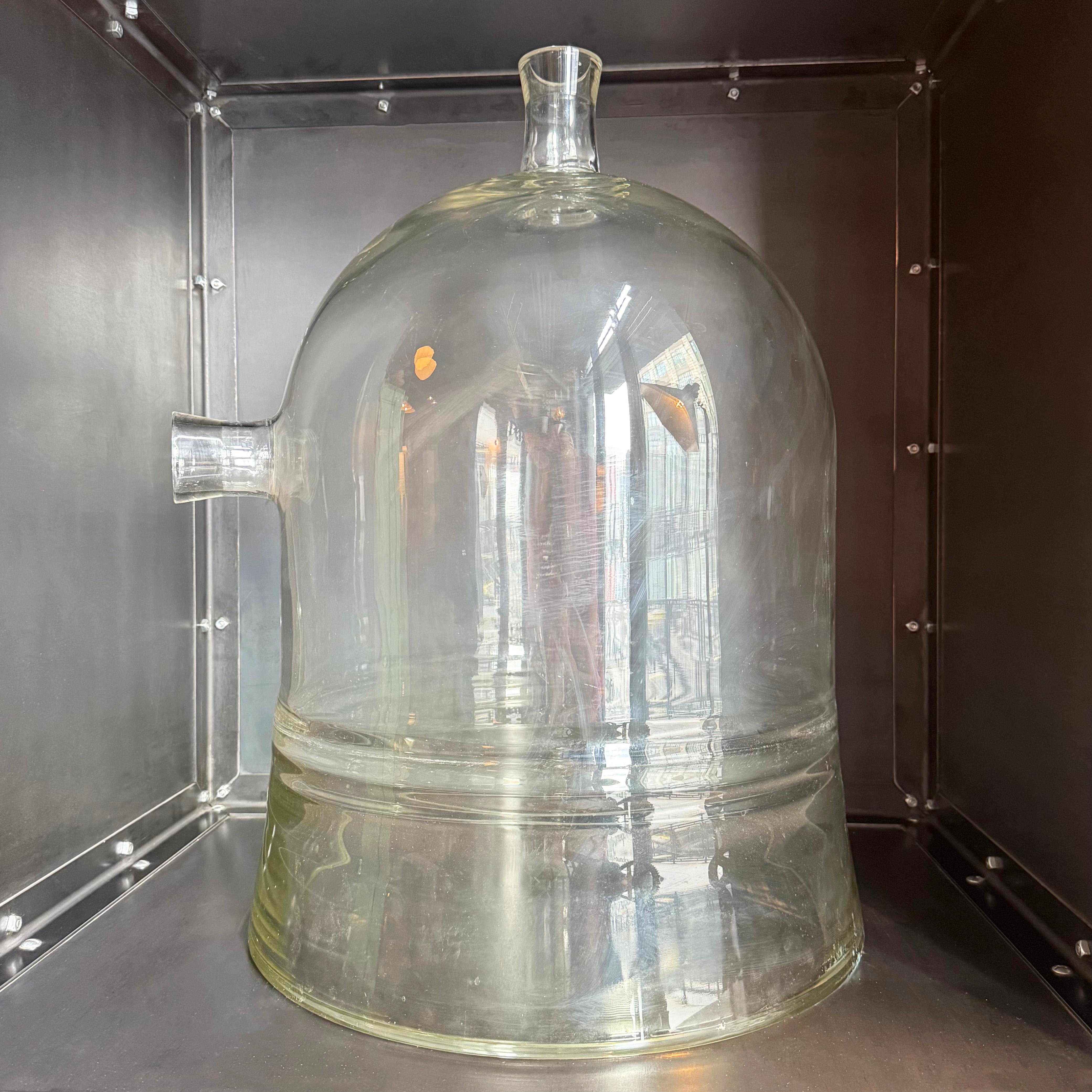 This oversized Industrial Pyrex glass bell jar is certainly a unique and an impressive art object. At 29