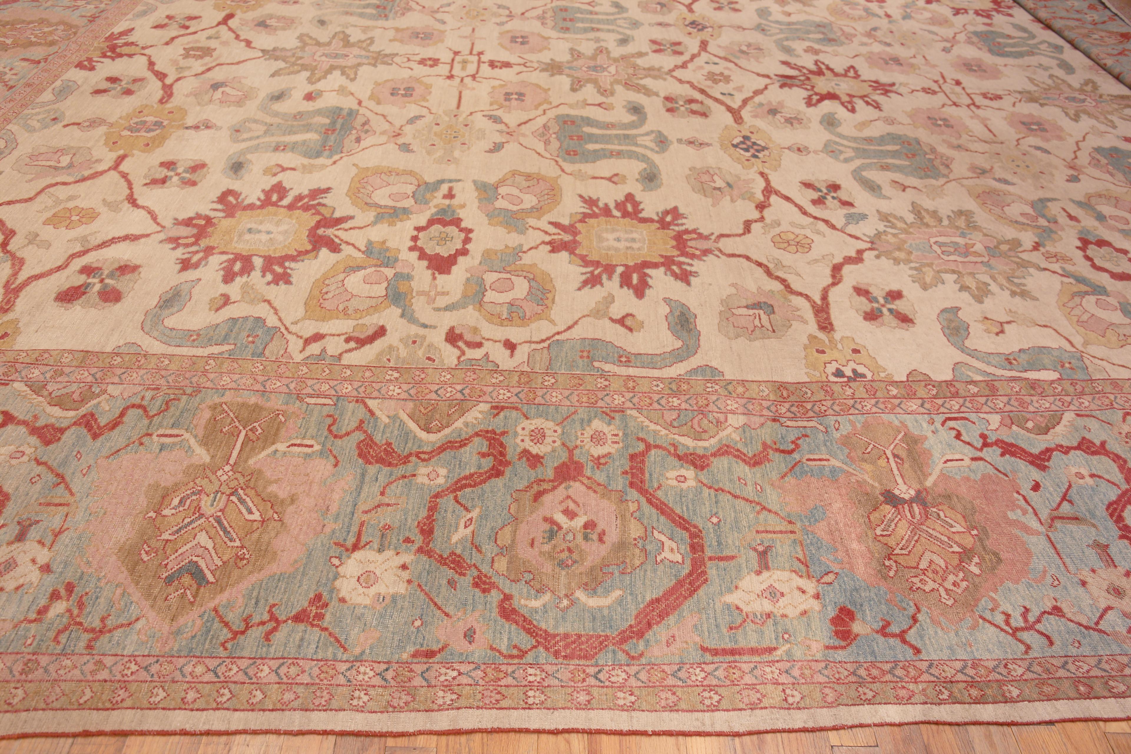 A Spectacular Oversized Luxurious Ivory Background Happy Jewel Tone Color Large Scale Design Antique Persian Sultanabad Rug, Country of Origin / Rug Type: Antique Persian Rug, Circa Date: 1900 