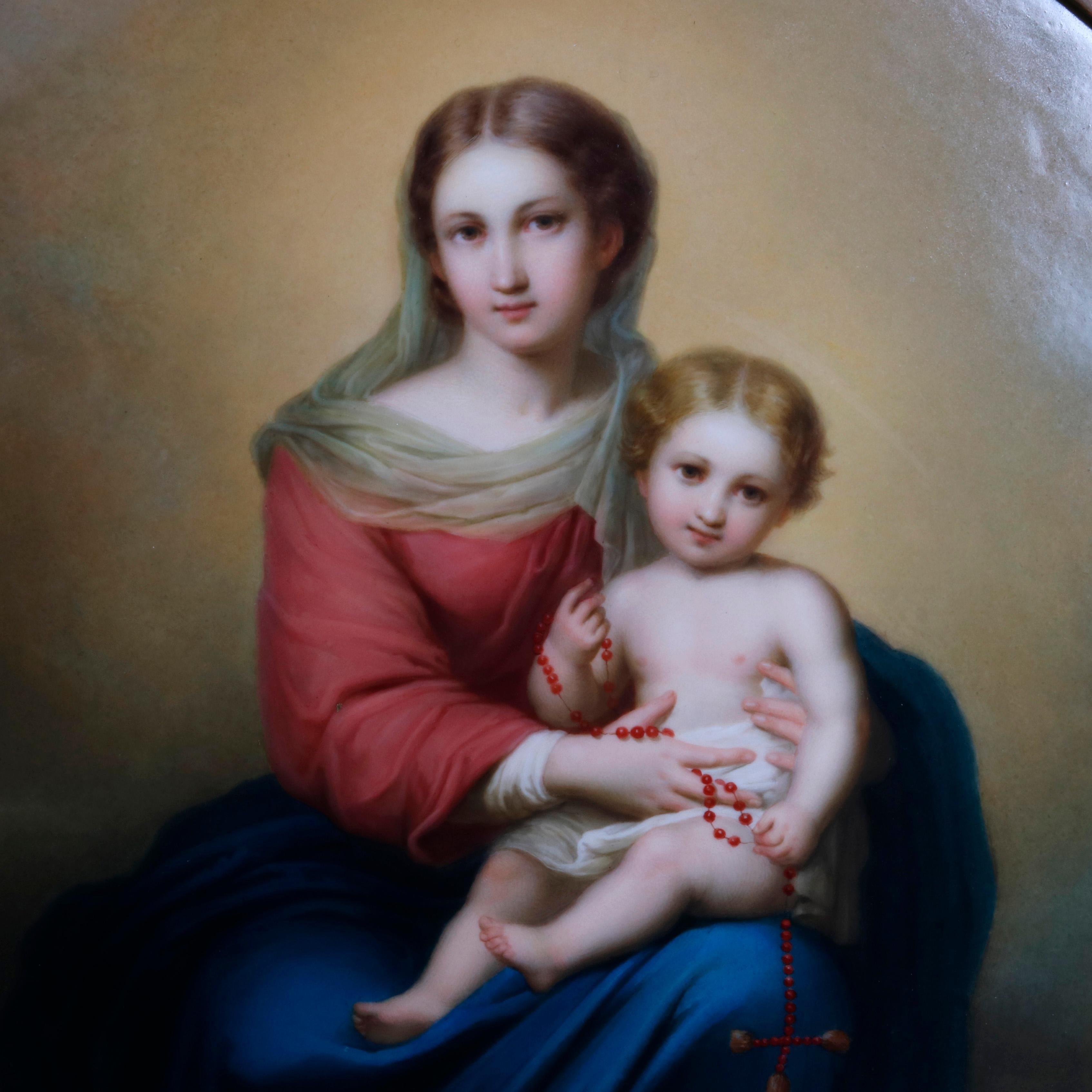 An oversized German KPM hand painted porcelain plaque depicts the seated Madonna of the Rosary and Christ Child with tending cherub angels, after Bartolome Esteban Murillo, stamped on back as photographed, seated in giltwood frame, late 19th