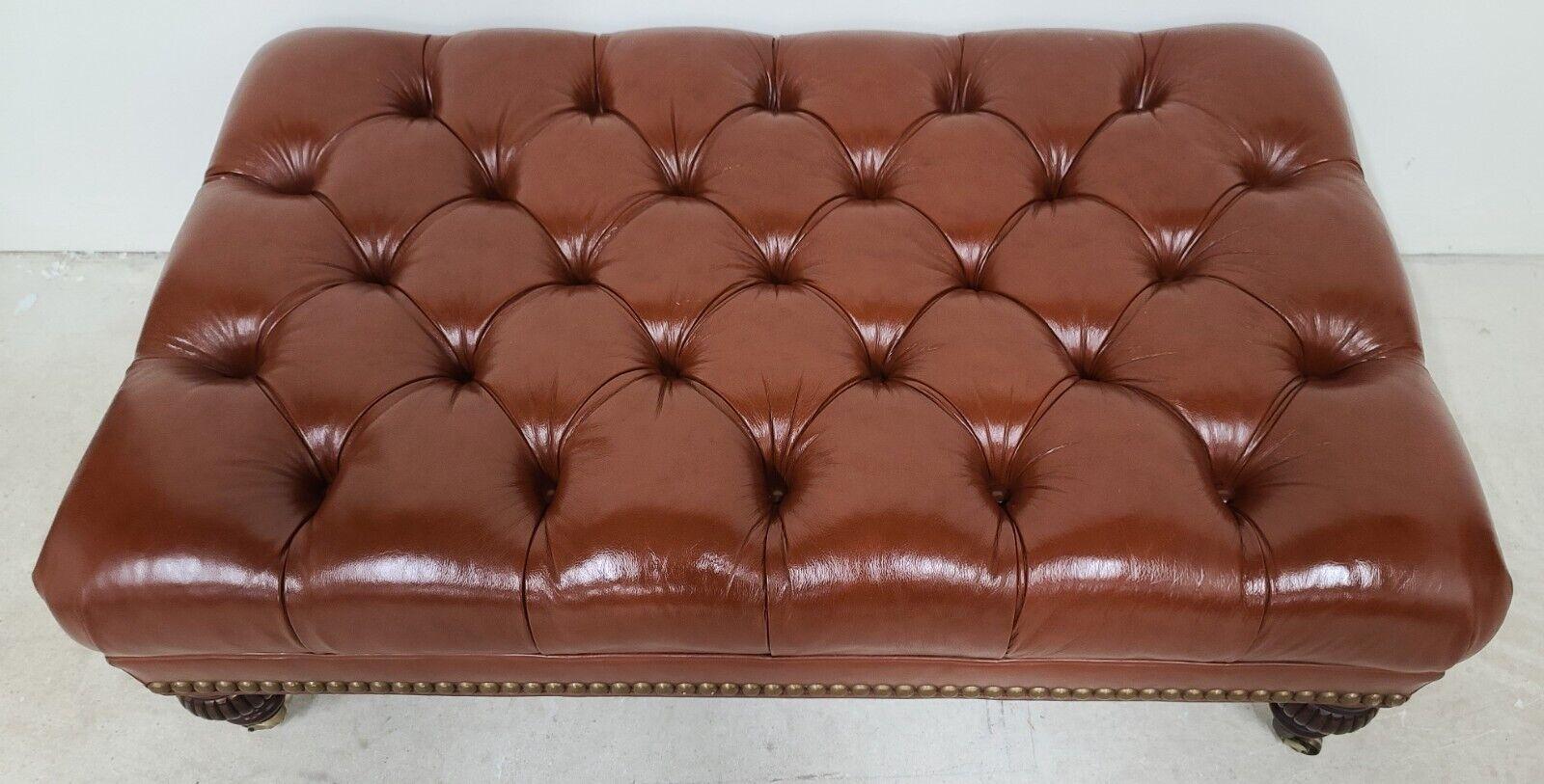 For FULL item description be sure to click on CONTINUE READING at the bottom of this listing.
Offering one of our recent palm beach estate fine furniture acquisitions of a
large chesterfield tufted real leather rolling ottoman footstool coffee