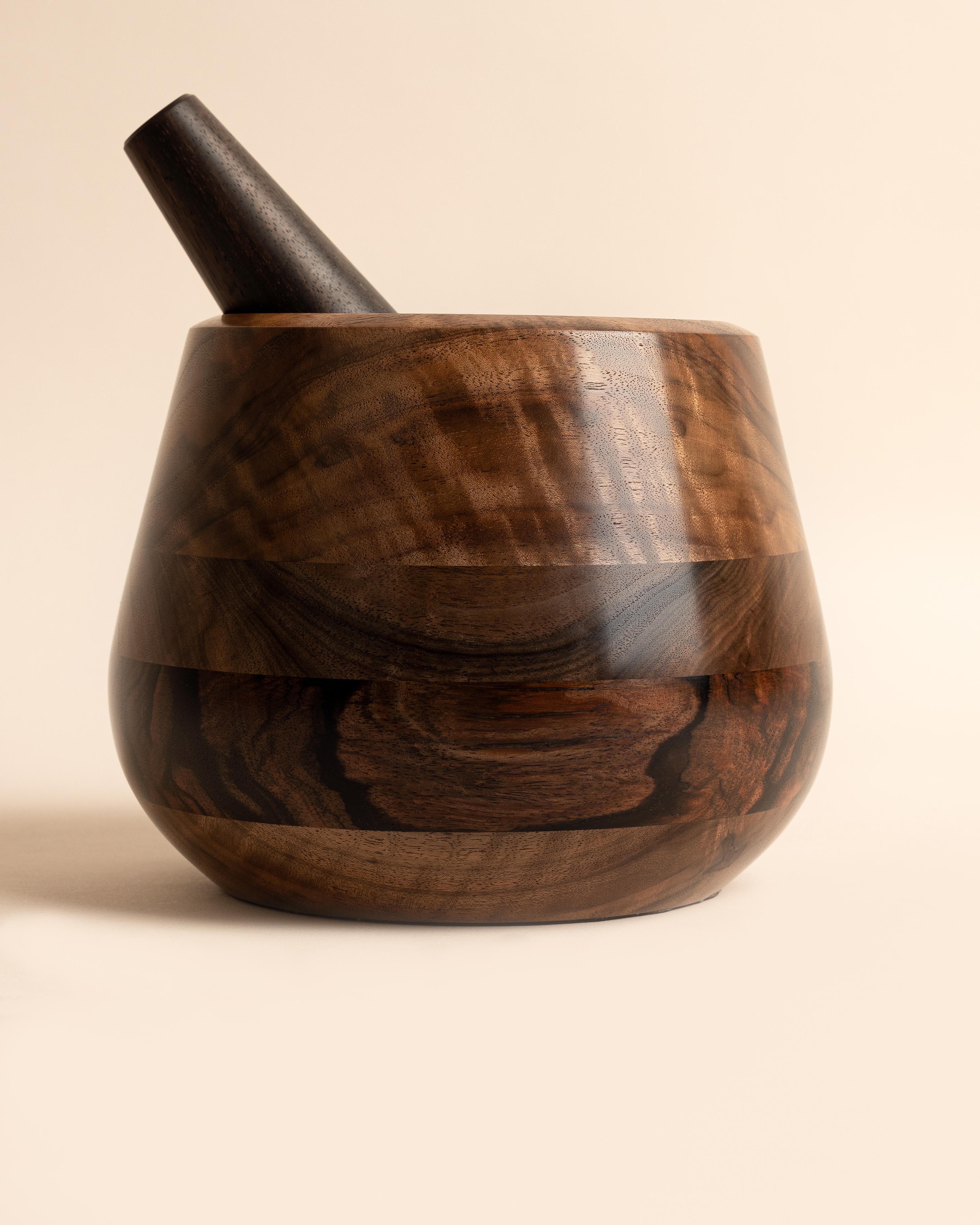 Hand turned mortar features beautifully figured California Claro walnut and Macassar Ebony. The hefty pestle is crafted entirely of Macassar along with the bottom third of the mortar. Ebony is renown for its hard, dense characteristics.