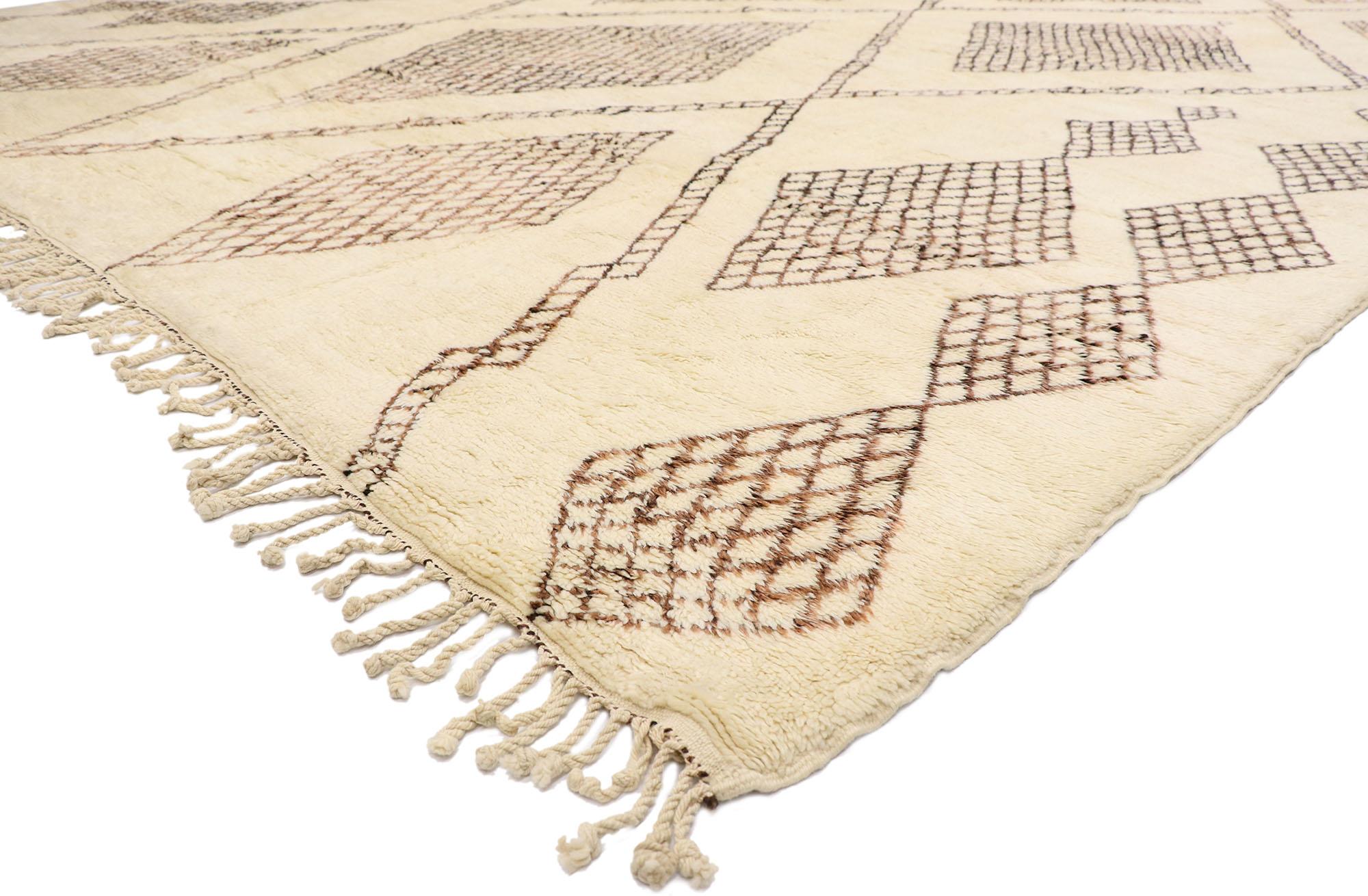 21144 Oversized Neutral Berber Moroccan Rug 13'09 x 18'02.
Nomadic charm meets the softer side of Shibui in this hand knotted wool Berber Moroccan rug. The intricate diamond silhouette and earthy neutral colors woven into this piece work together to