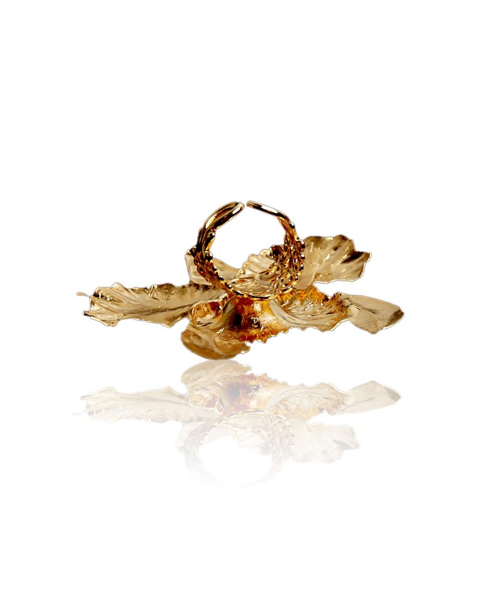 This oversized orchid ring is the perfect statement and conversation piece to upgrade and complete a lux look. 
Made of plated brass with a center freshwater pearl pistil.

                                                                            