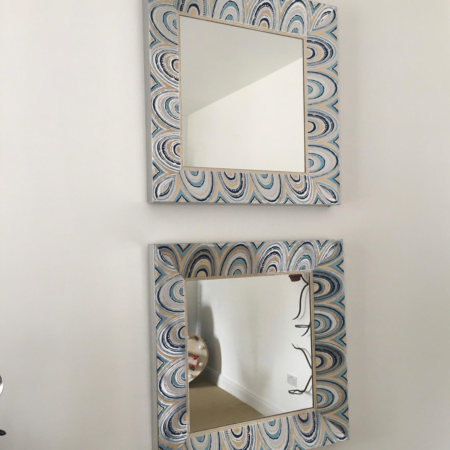 Pair of oversized square shaped mirrors. Fully embody all the glamour and flamboyance of the 1970s. So special and unique the sides are in a matte chrome color and the front is a patterned 'Mylar' finish. Sold independently but perfect as a pair.