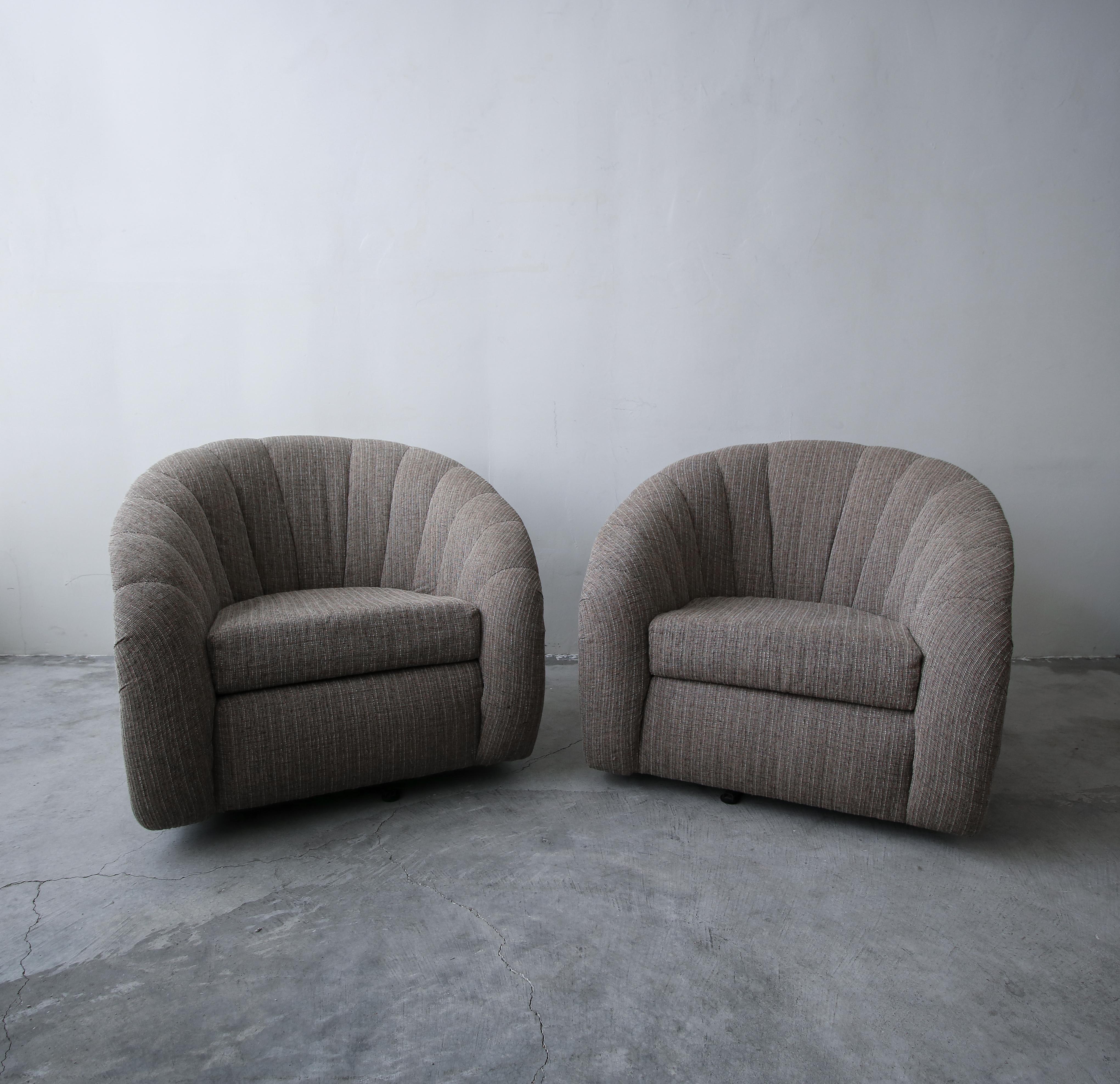 Nice oversized pair of barrel swivel chairs by Sally Sirkin Lewis for J. Robert Scott.

Chairs sold as found. Fabric is in good usable condition with no odors, rips, tears or stains, minimal wear. Chairs swivel well.