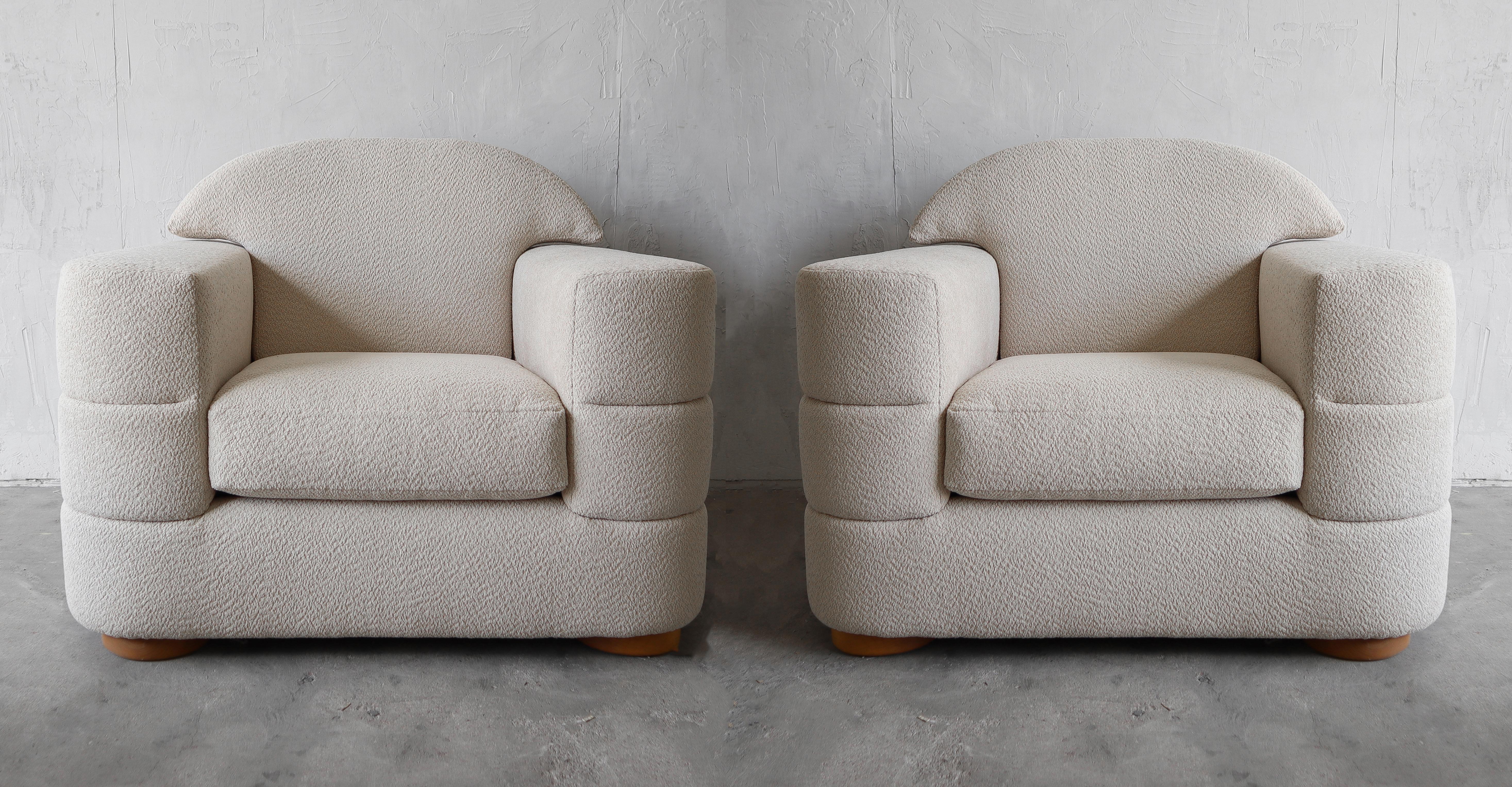 PICTURES DO THESE CHAIRS NO JUSTICE. This stunning pair of oversized channeled lounge chairs are perfect for a large space. Although large, the femininity of their shape adds to their appeal, the lines will really soften a space. The neutrality of