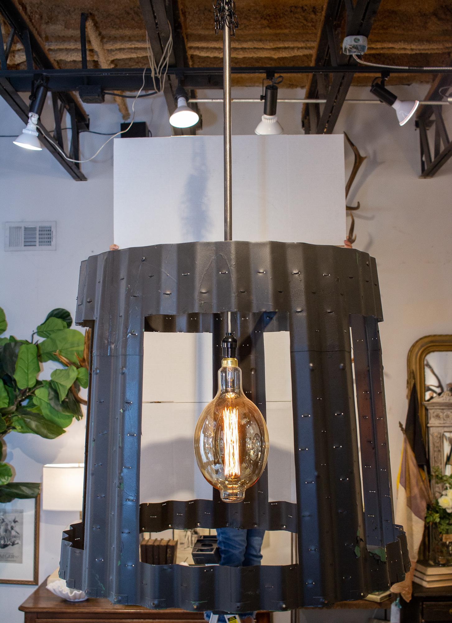 These unique statement chandelier has been crafted using vintage aircraft parts and modified by adding openings to the 