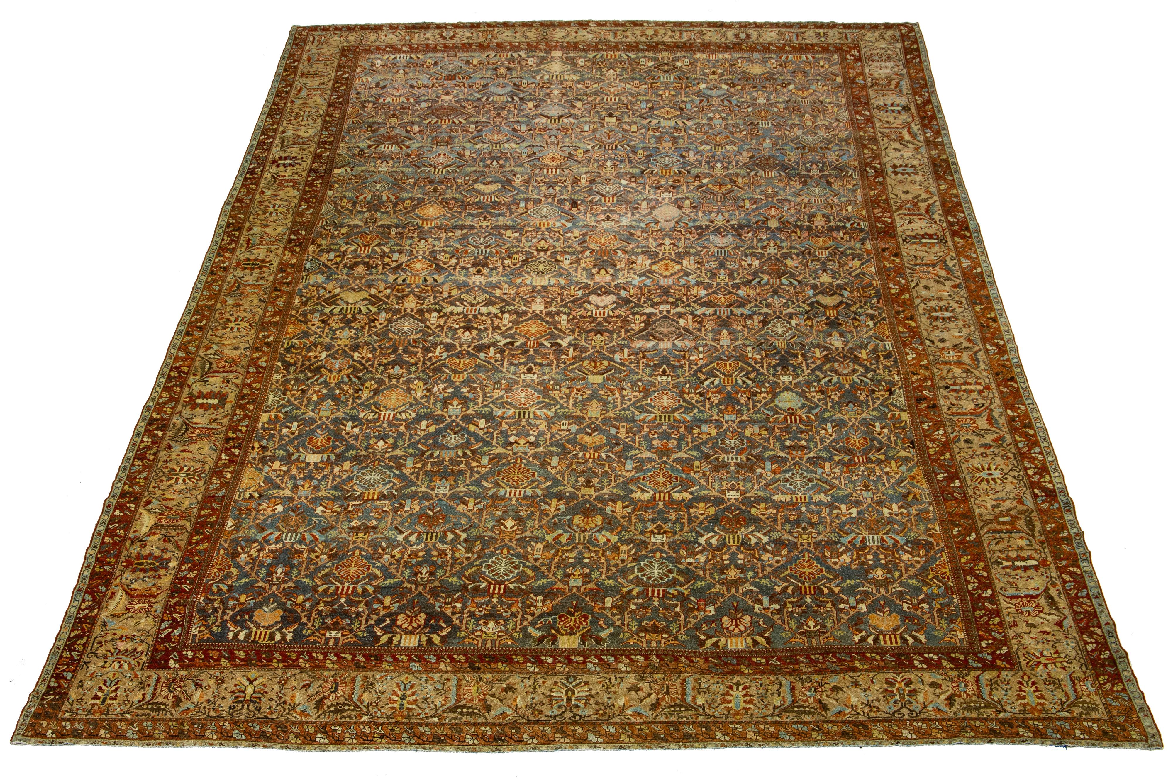 Beautiful Antique Bakhtiari hand-knotted wool rug with a blue color field. This Persian piece has a classic multicolor floral design.

This rug measures 15'9
