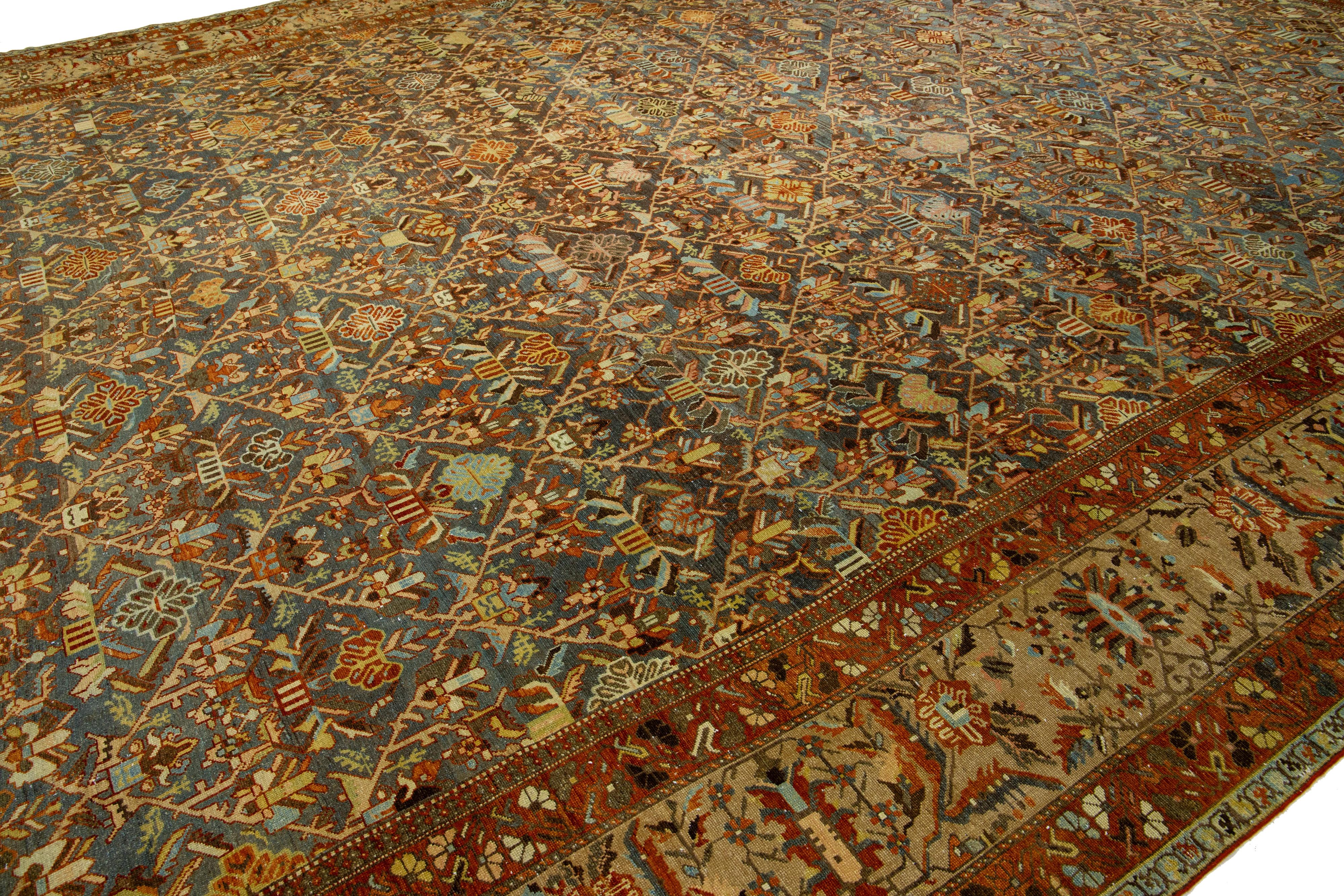 Islamic Oversized Persian Bakhtiari Blue Wool Rug, handcrafted in the 1900s For Sale