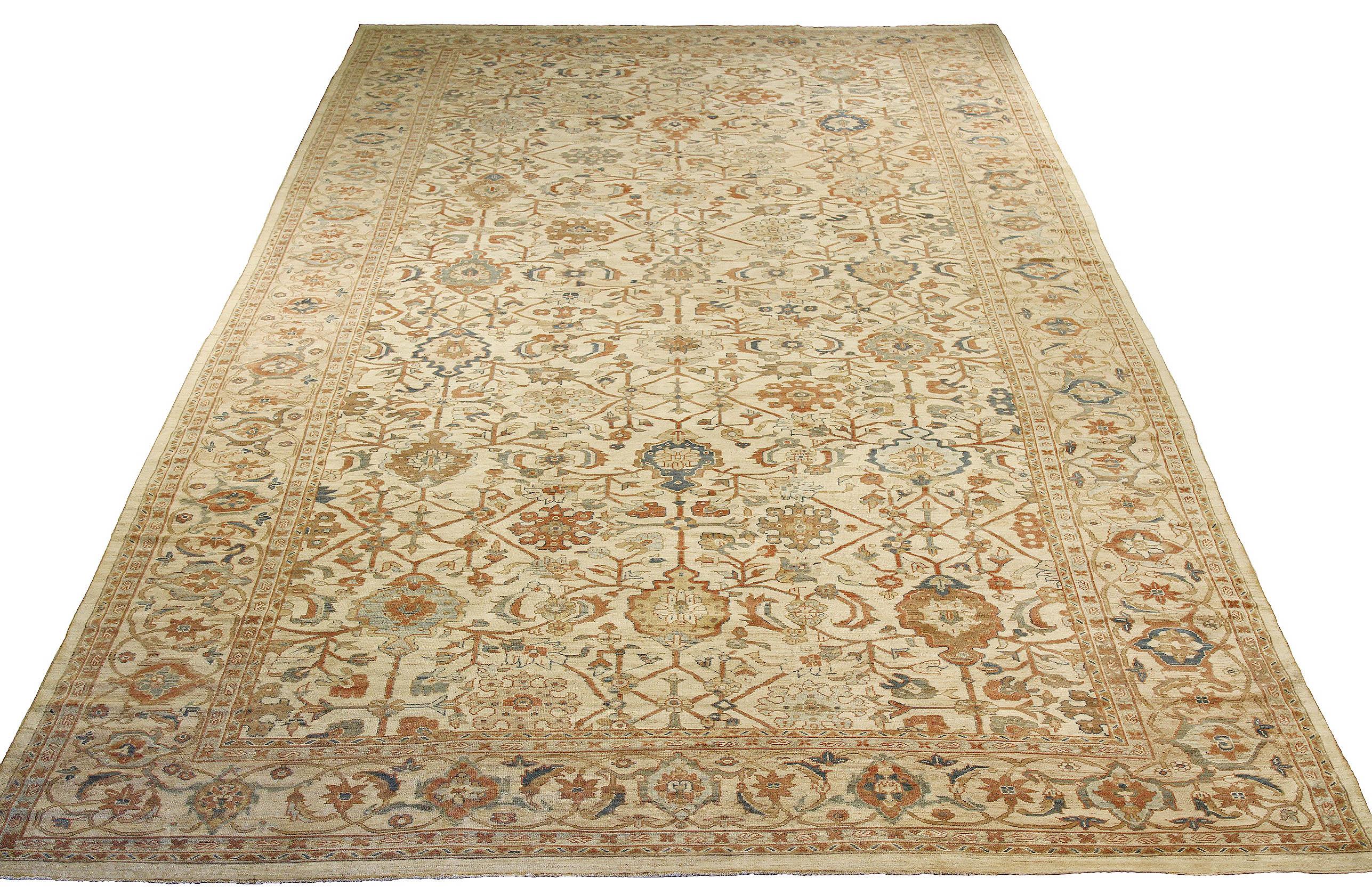 Oversized handmade Persian area rug from high-quality sheep’s wool and colored with eco-friendly vegetable dyes that are proven safe for humans and pets alike. It’s a classic Sultanabad design showcasing a regal ivory field with prominent Herati