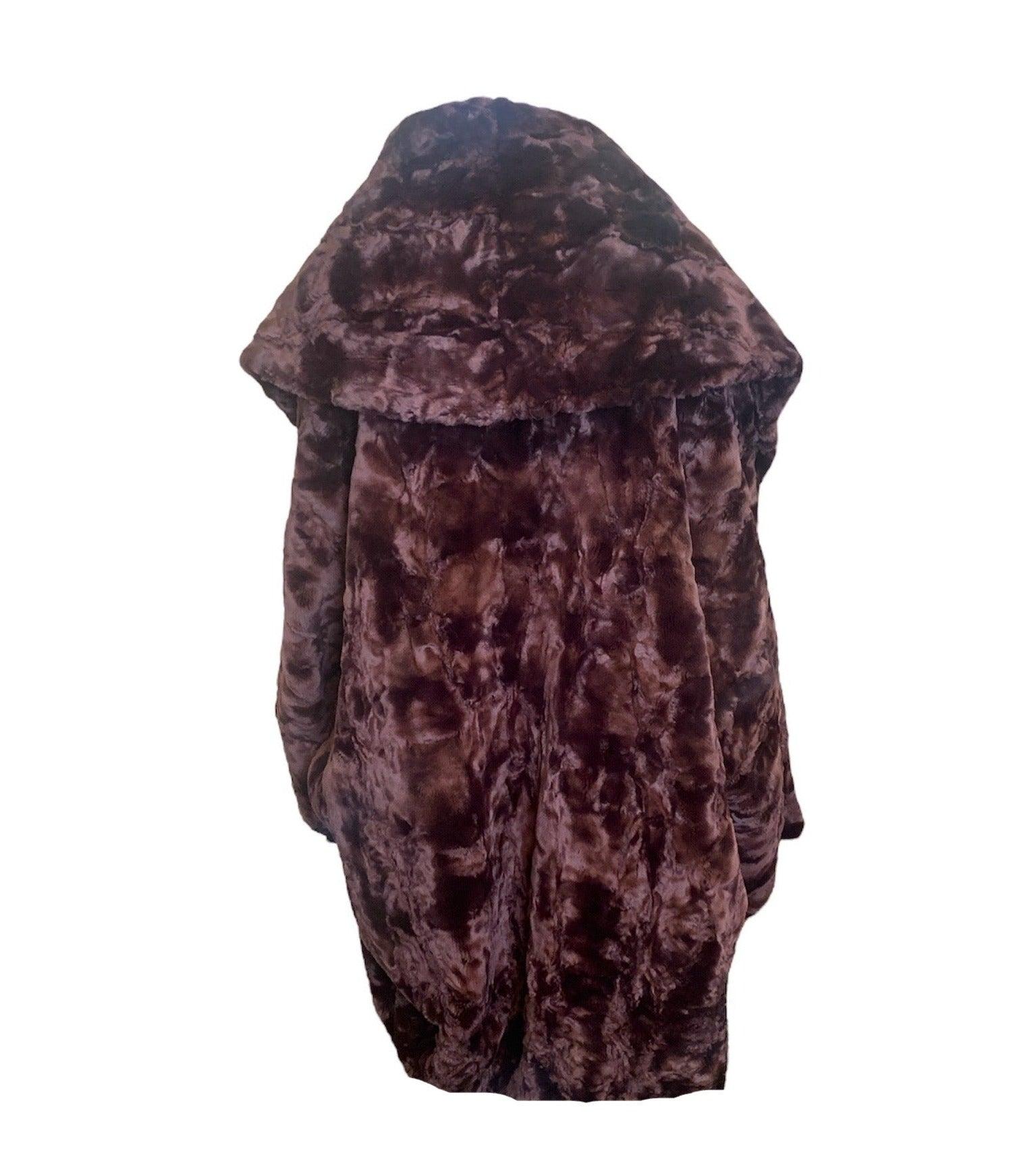 Stay warm and stylish during winter with this luxurious unlabeled burgundy textured faux fur coat. Circa early 2000s, this oversize cocoon-style coat features a teddy bear-like plush fabric. Reminiscent of Romeo Gigli in that period.  With an open