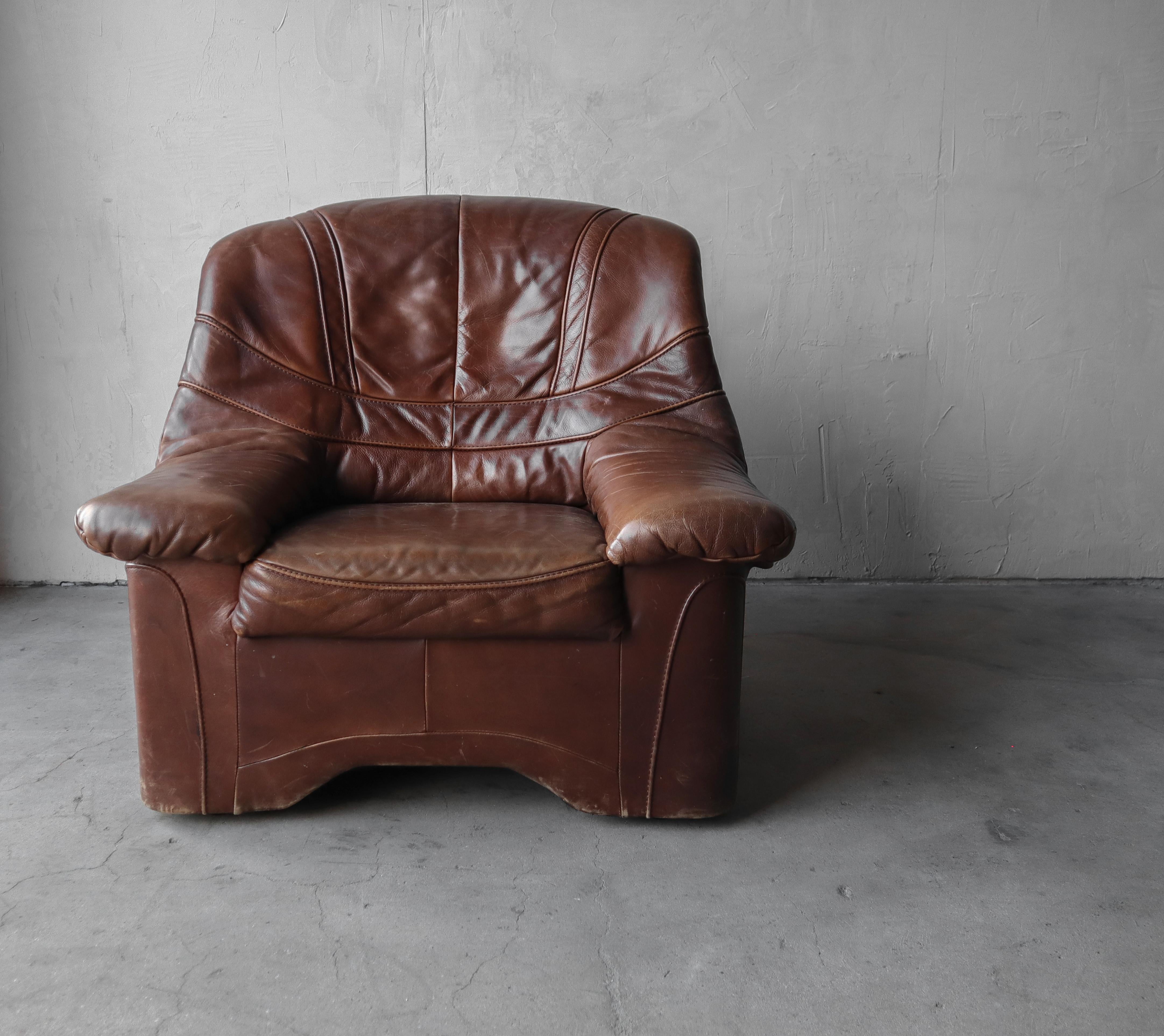 Postmodern Brazilian leather lounge chair. The chair is large and comfortable, perfect for a mancave.

The chair is comfortable and structurally sound. The leather is in great condition overall with some character adding patina.
  
    

  