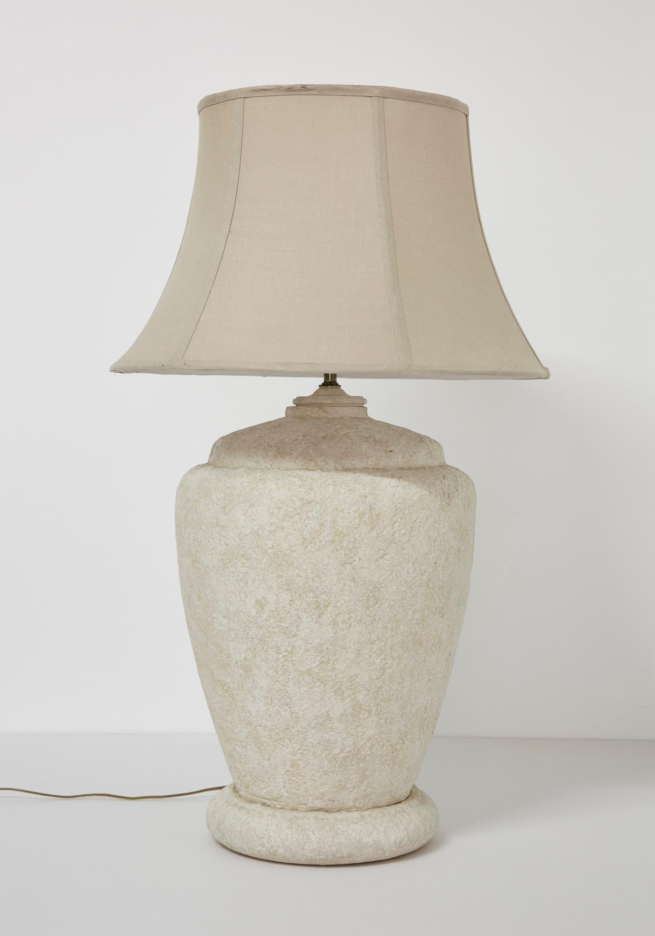 Postmodern urn-shaped ceramic table lamp in a very large size with real presence. Textured mottled cream colored neutral finish. Brass neck.

Underside stamped with maker's mark.

Body of lamp only measures 23 in. high.

Shade not included.