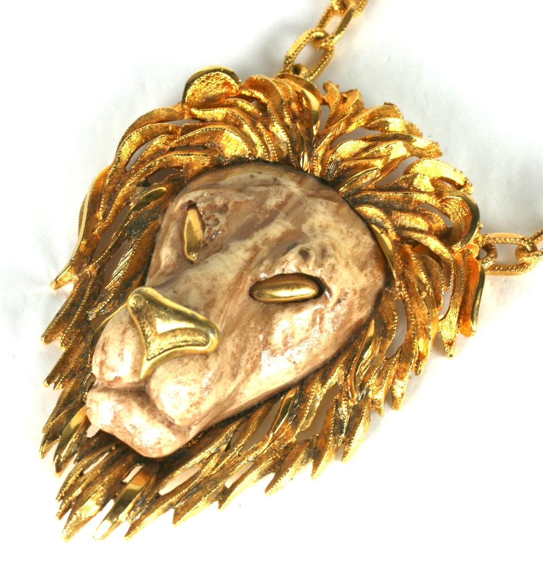 Razza oversized lion head pendant with a prominent mane of molded resin and gilt metal.  Gilt  rectangular chain forms pendant necklace. 
Excellent Condition, Unsigned. 
Pendant Length: 4 1/4