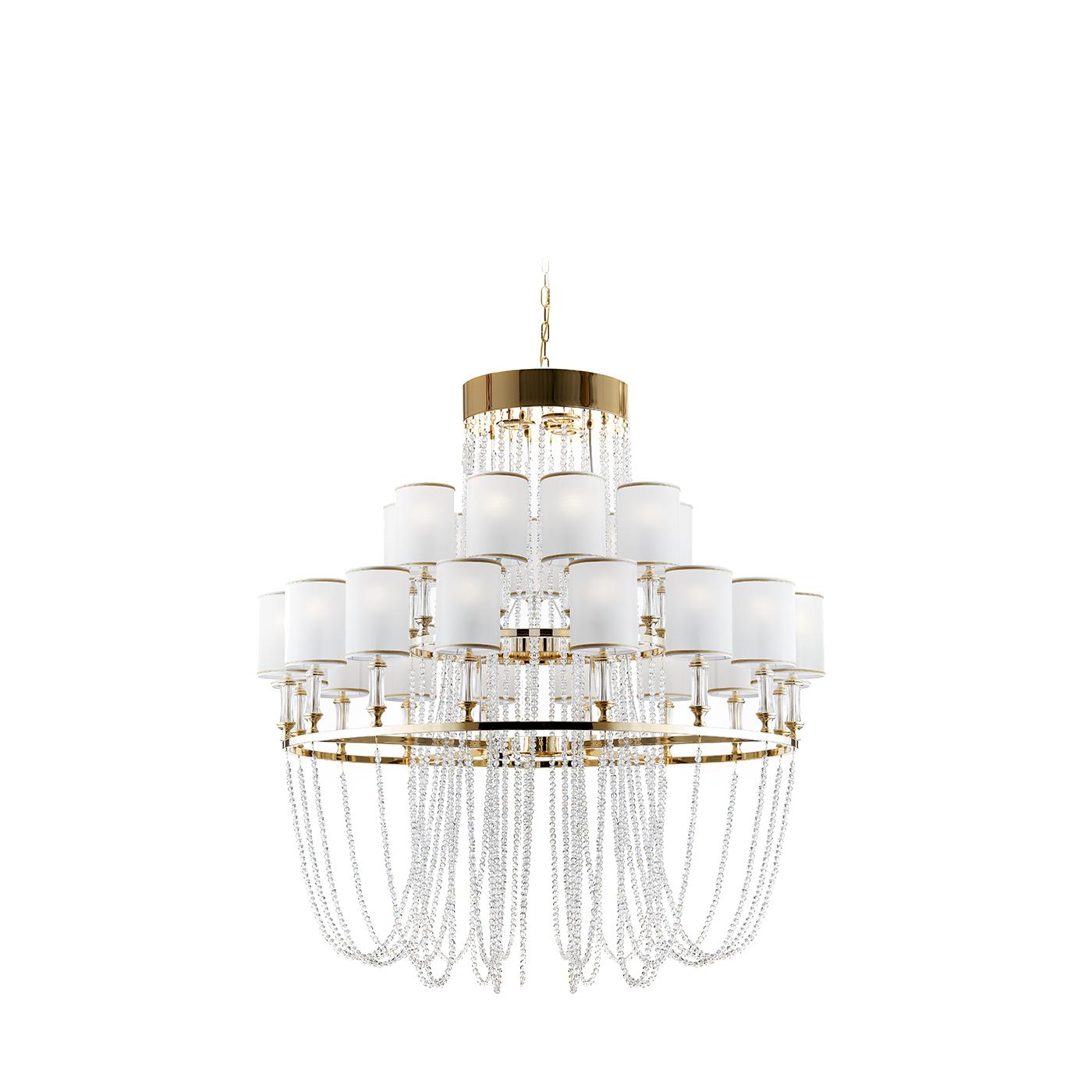 Part of the Ring collection, this exquisite chandelier is inspired by the Art Deco style and infused with romantic elements. The\nstructure in metal has a polished brass finish completed at the top with a small ring connected to two layered rings.