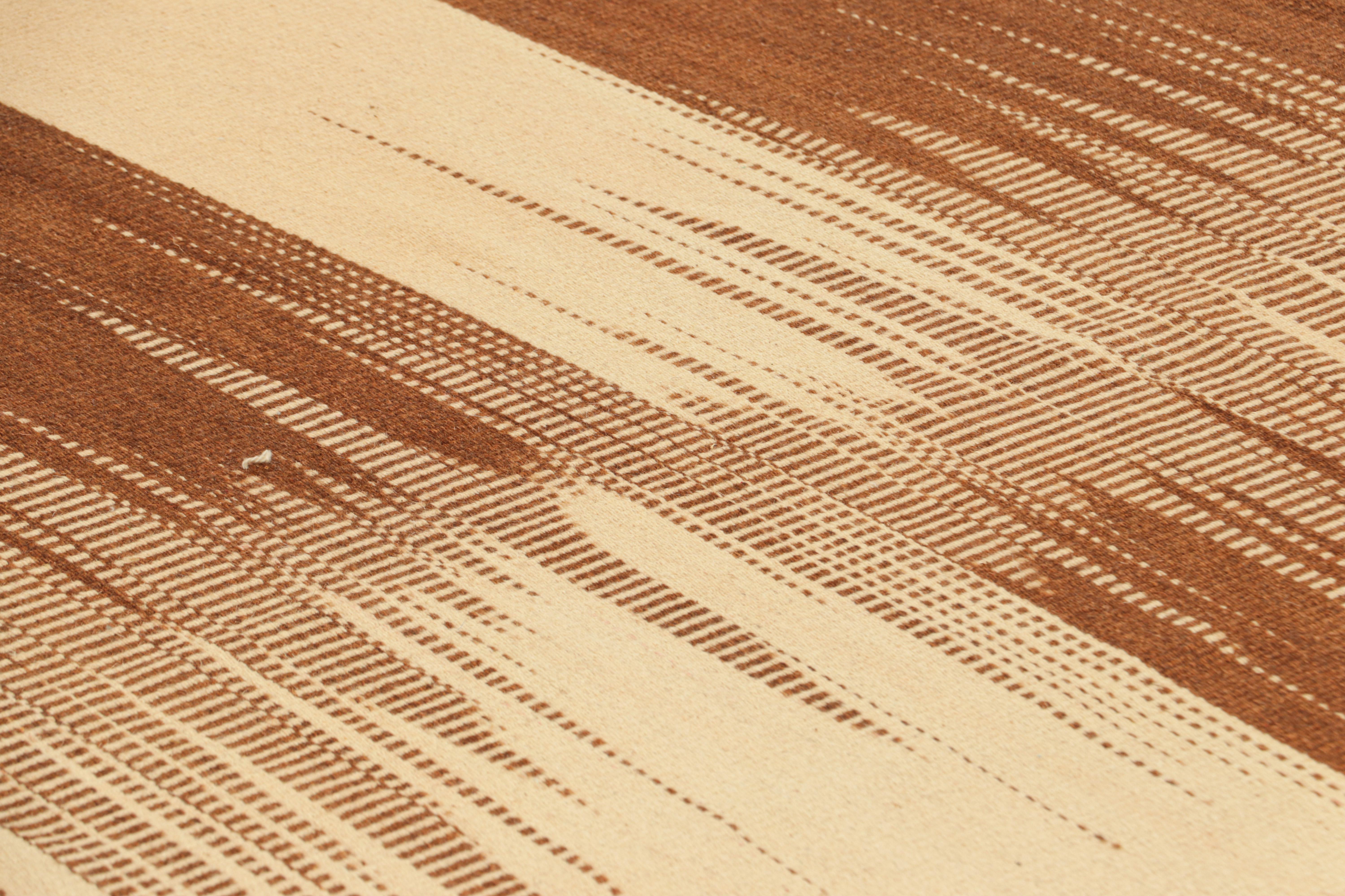 Handwoven in wool, this 12x16 oversized Kilim is from an inventive new contemporary flat weave collection by Rug & Kilim.

On the Design: 

This modern take on classic panel-weaving enjoys a fabulous, unique play of beige and brown textural stripes
