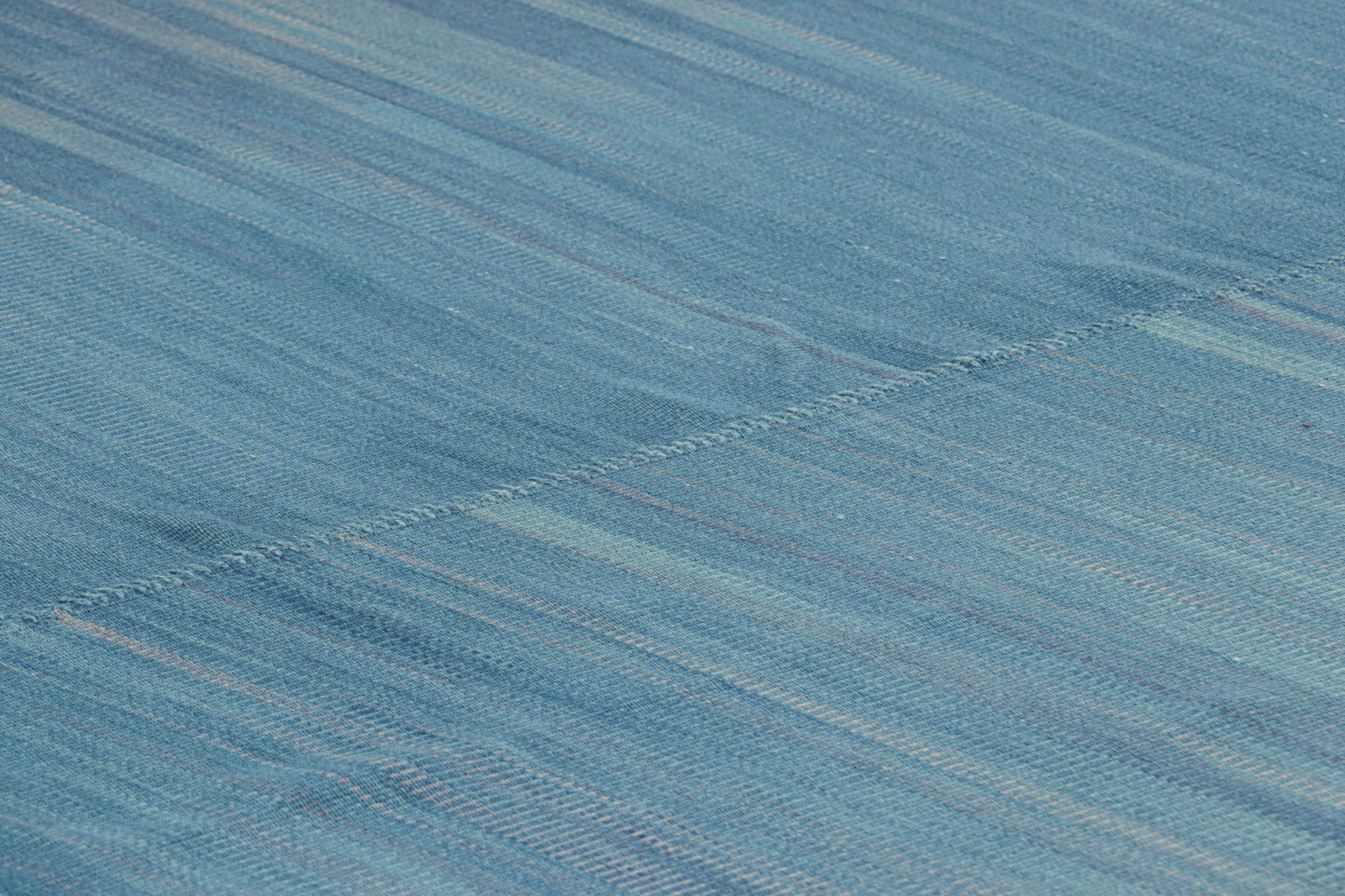 Handwoven in wool, this 11x16 oversized Kilim is from an inventive new contemporary flat weave collection by Rug & Kilim.

On the Design: 

This modern take on classic panel-weaving enjoys a fabulous, unique play of blue textural stripes and