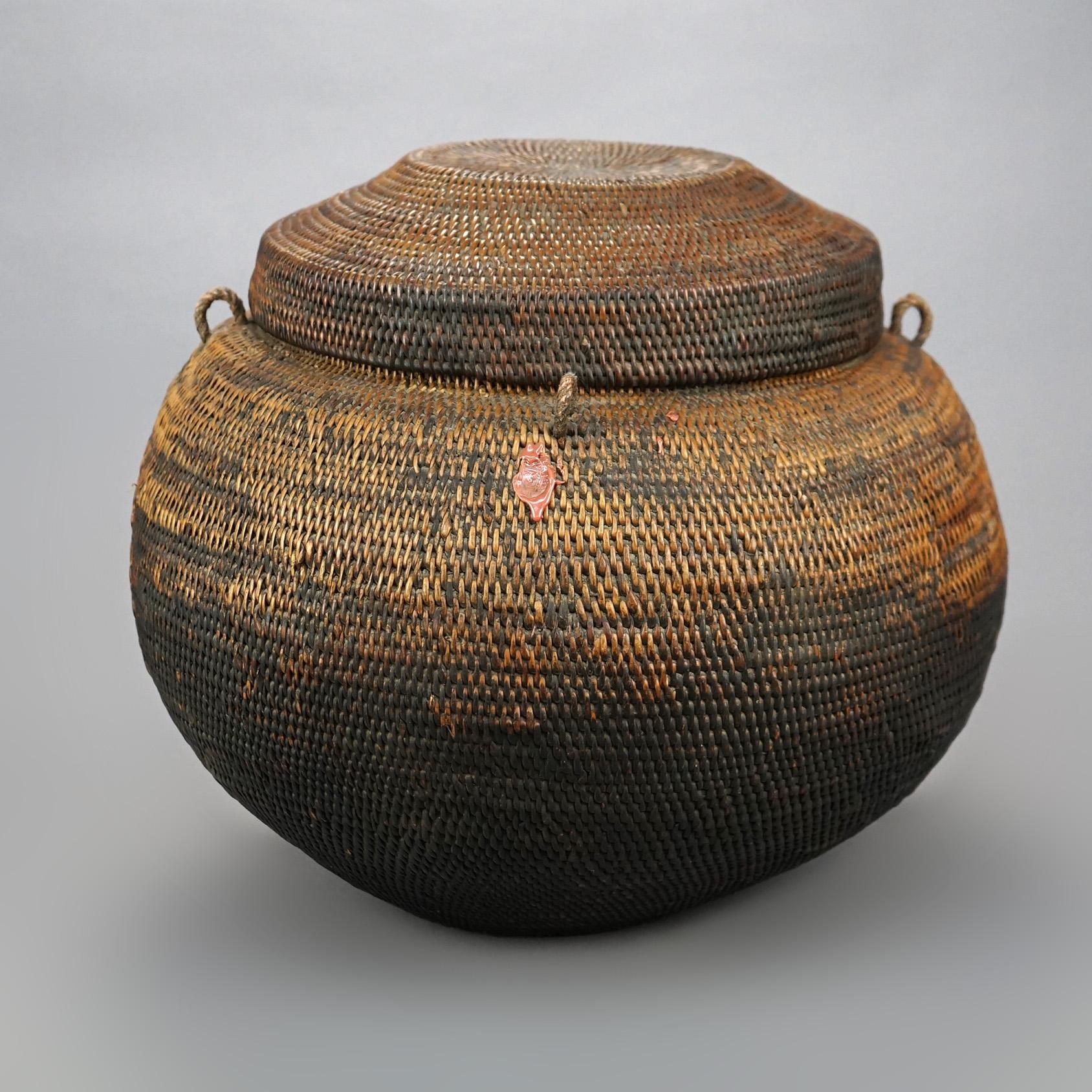 A large South American Lidded Wicker Basket in Spherical Form, 20th century.

Measures - 14.5