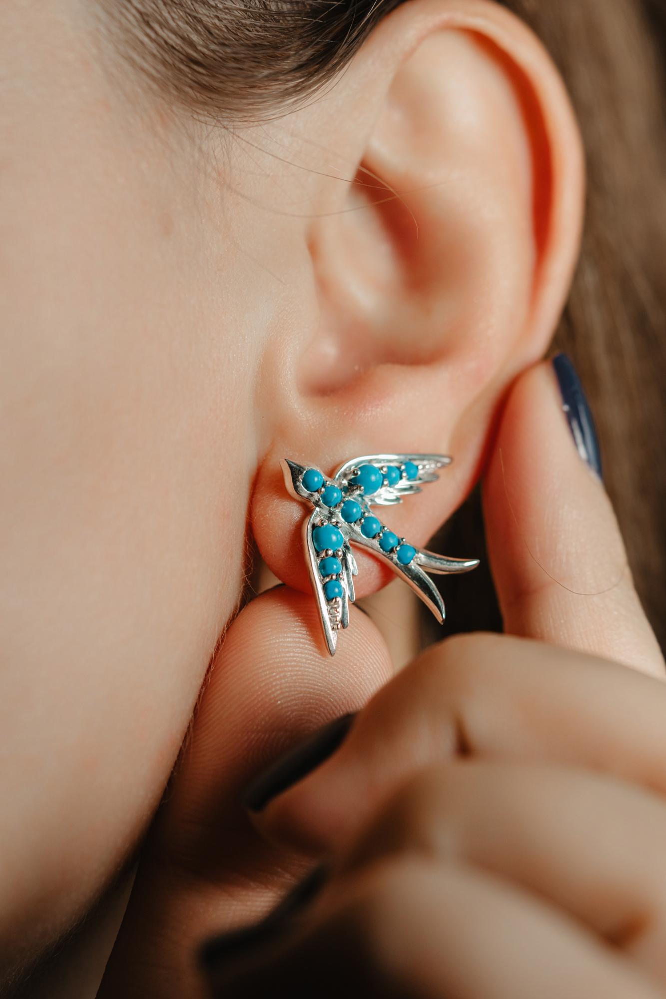 A perfect love token piece of jewelry! Romantic and very symbolic this antique revival studs are handmade by our goldsmiths. Made of solid sterling silver, these beautiful Victorian style swallow earrings are set with natural turquoise