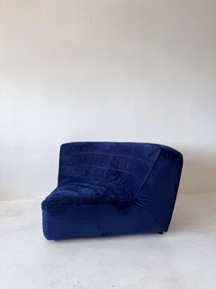 oversized Timothy Oulton blue velvet corner chair