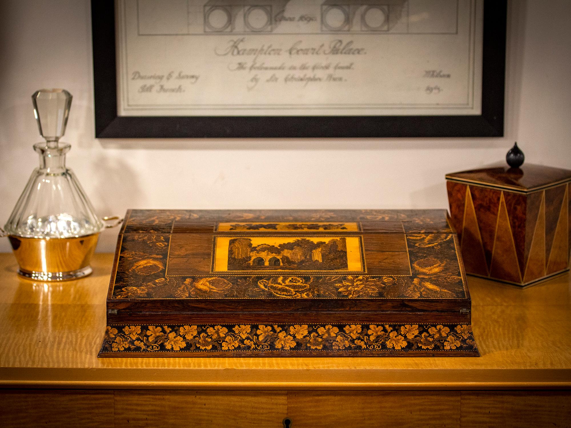 View of Bayham Abbey with Writing Implements 

From our Tunbridge Ware collection, we are delighted to offer this unusual and large-sized Tunbridge Ware Writing Slope, in the manner of Henry Hollamby. The Writing Slope crafted from Rosewood is