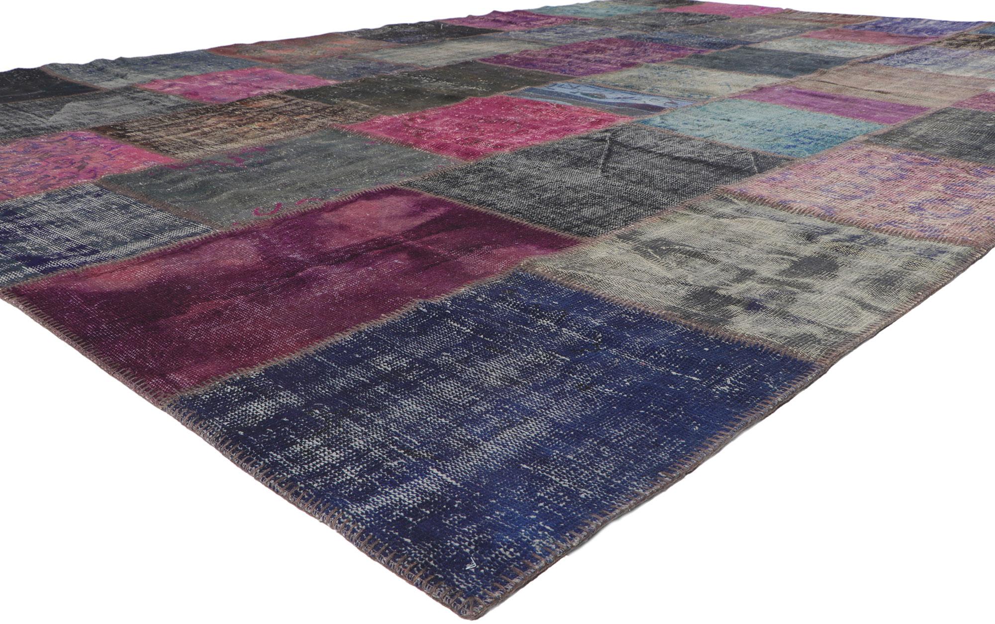 52130 Vintage purple patchwork rug 11'00 x 16'03. Cleverly composed with well-balanced asymmetry, this hand-knotted wool vintage patchwork rug is a captivating vision of woven beauty. The eye-catching geometric pattern and lively purple colors woven